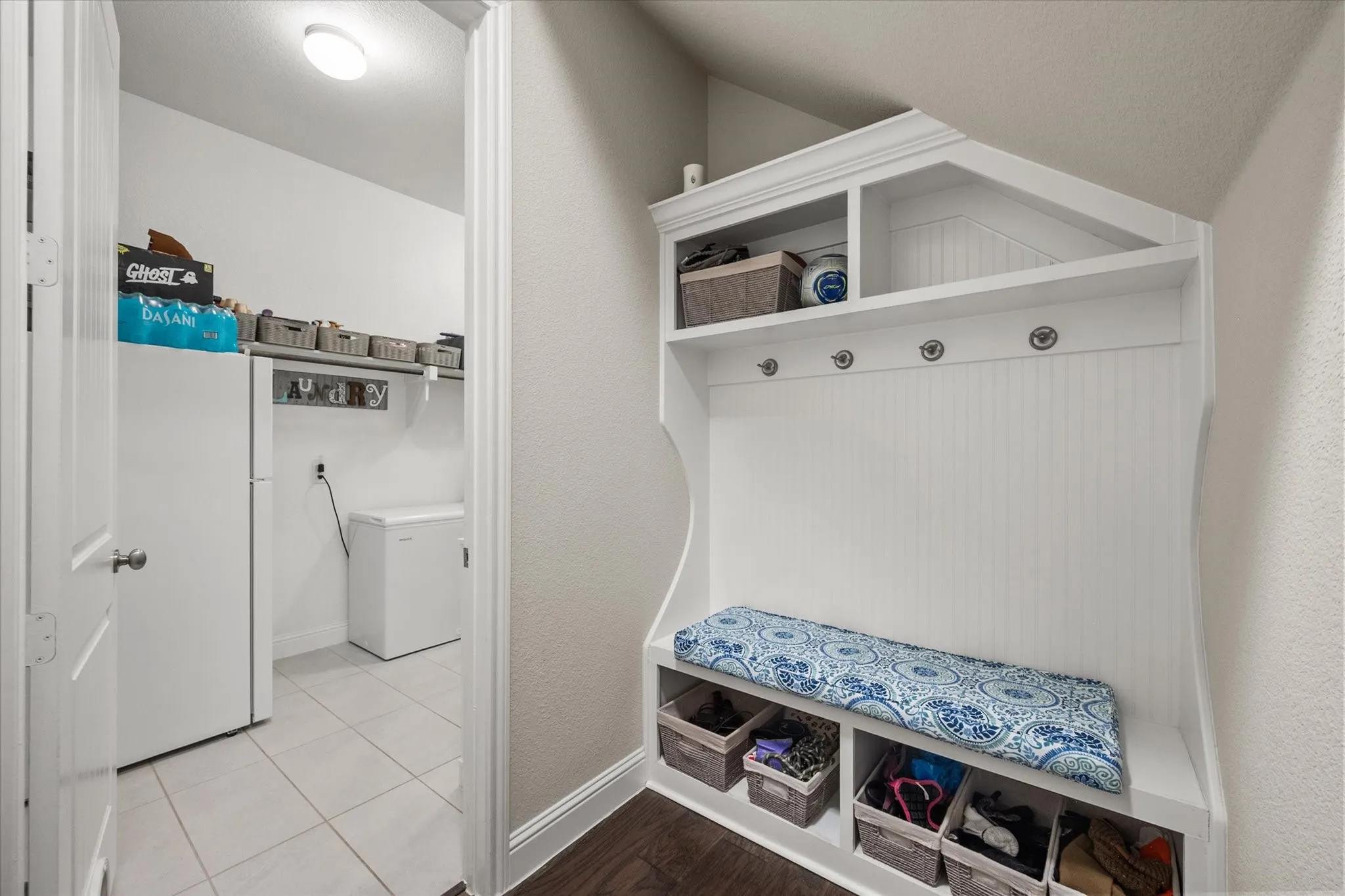 Mud room located just inside garage entry & adjacent to laundry room