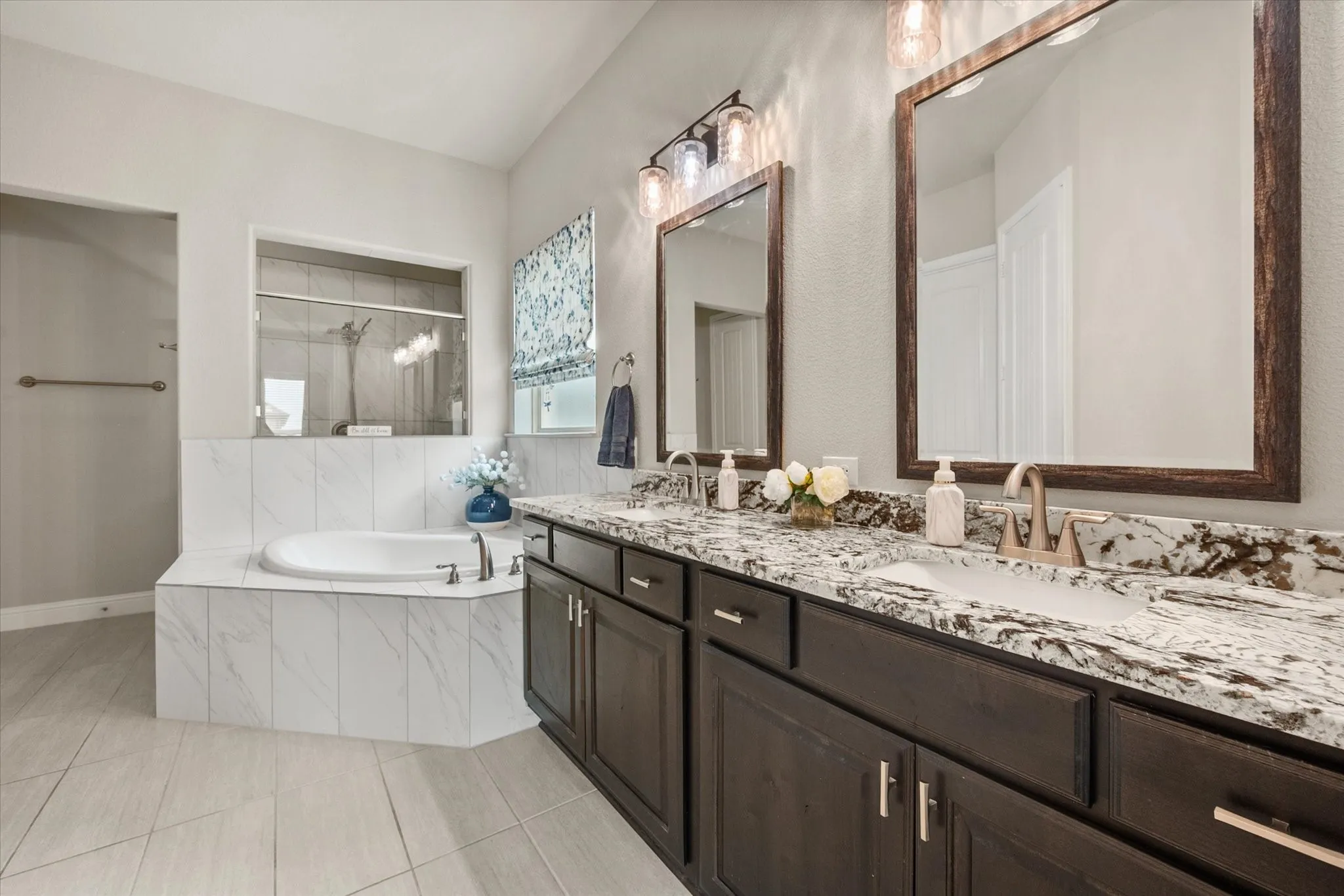 Granite dual sink vanity, soaking tub and separate shower & storage closet