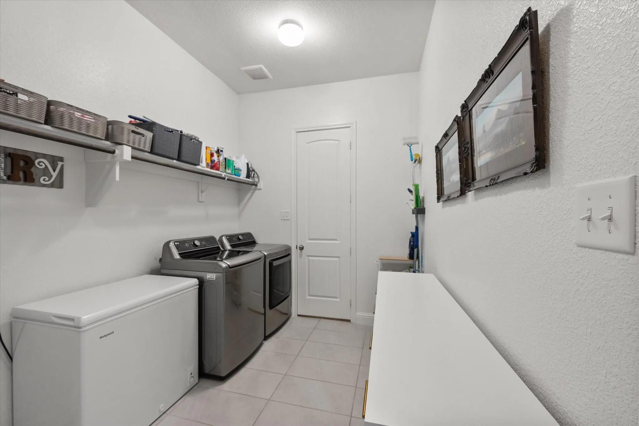 Oversized utility room that connects to the primary closet!