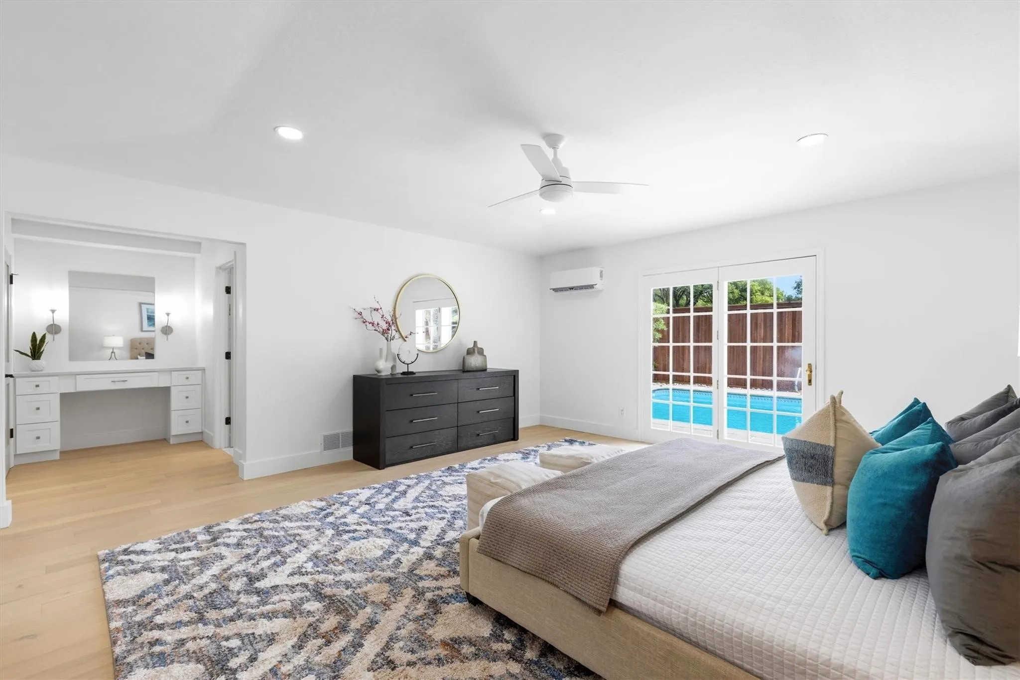White walls with recessed lighting and a ceiling fan