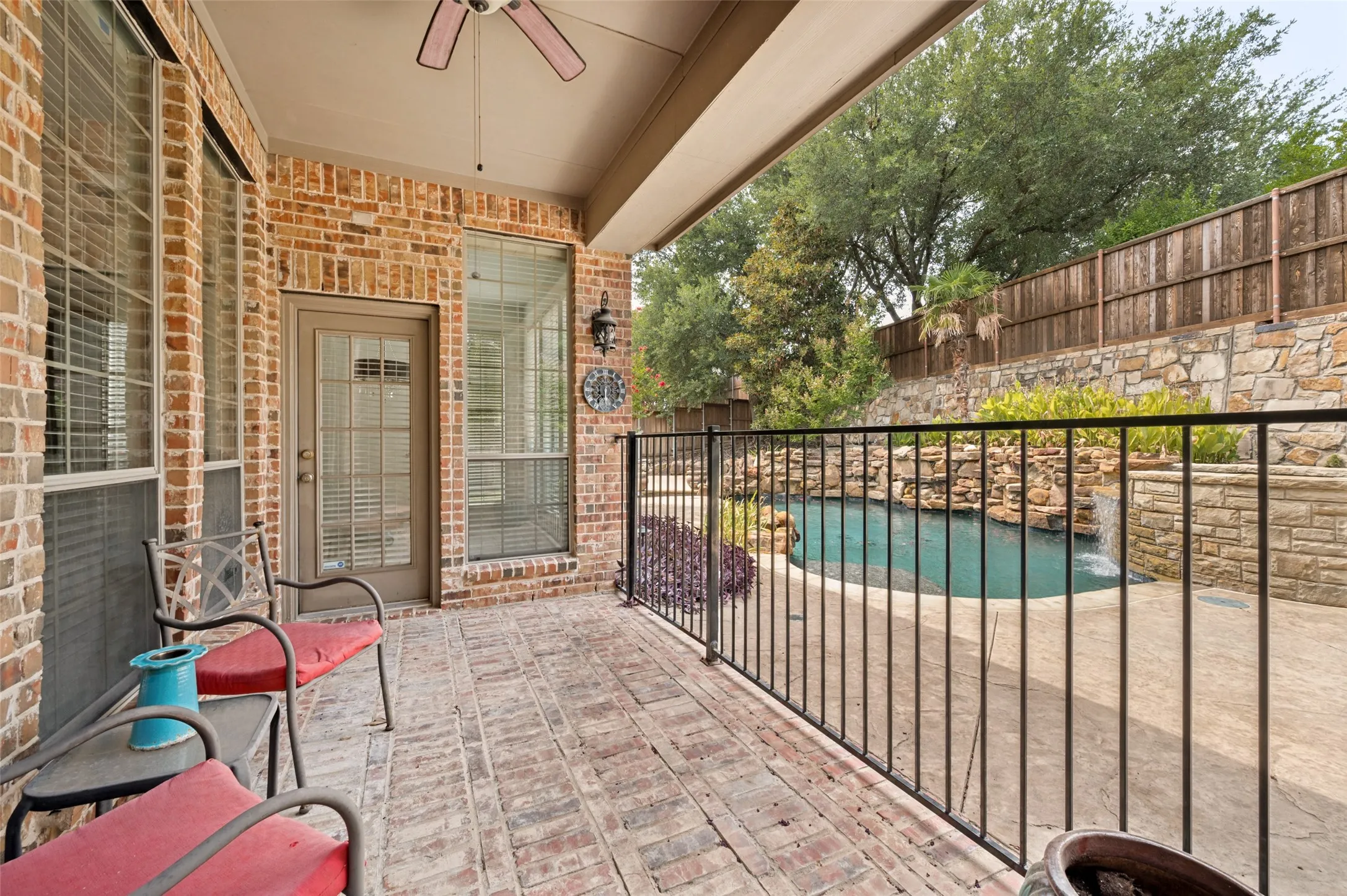 Wrought iron fencing around pool for child safety.  Also makes a great dog run!