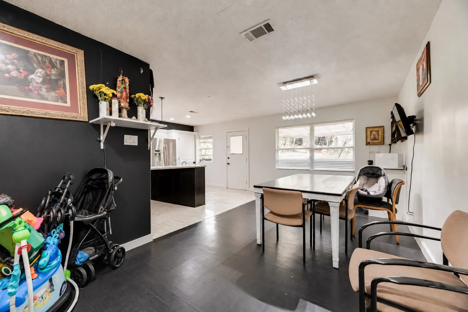 Dark wood-finish flooring with contrasting light-colored wall paint