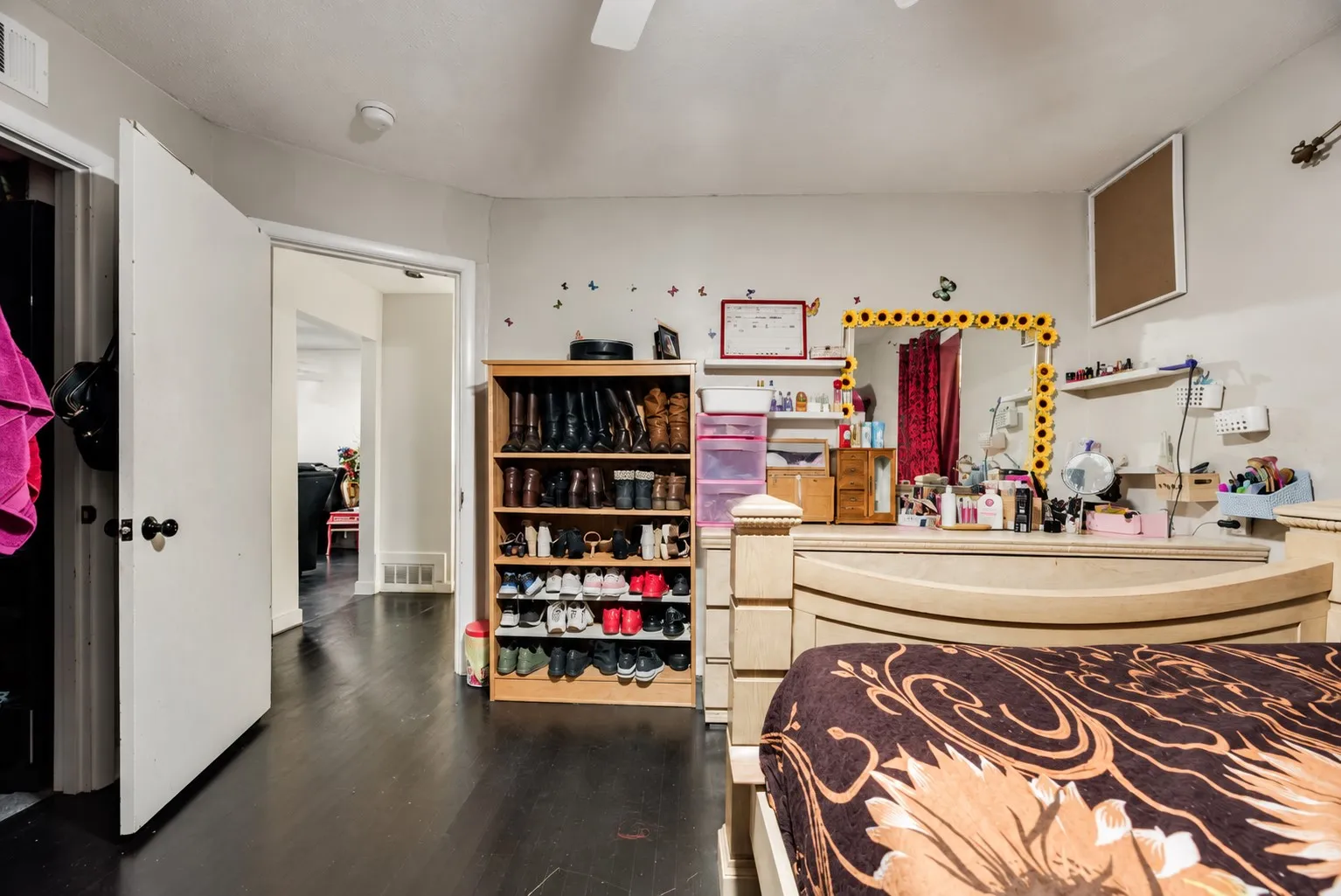 Dark wood-finish flooring with light wall tones