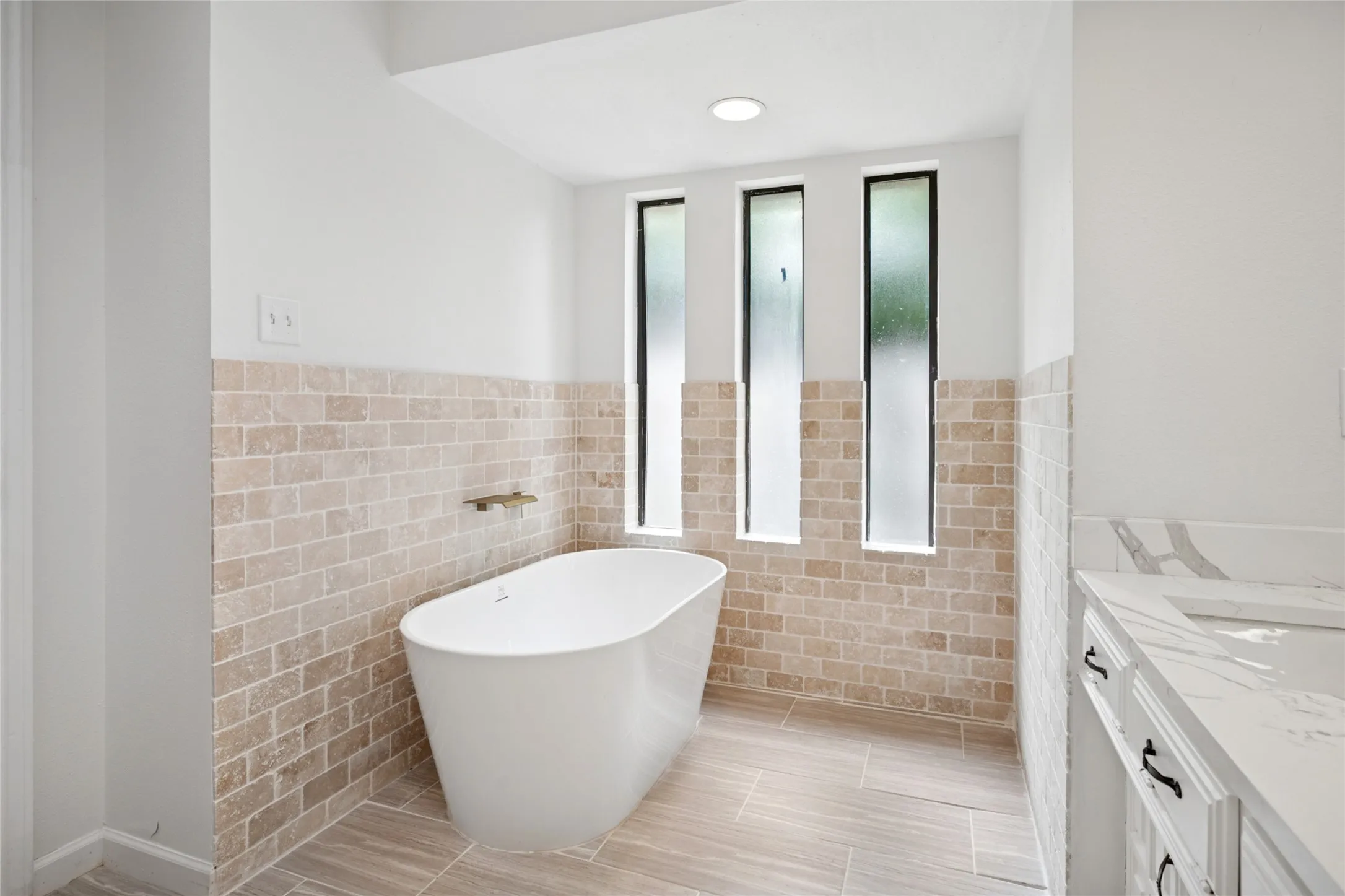 Primary bath with windows and separate tub