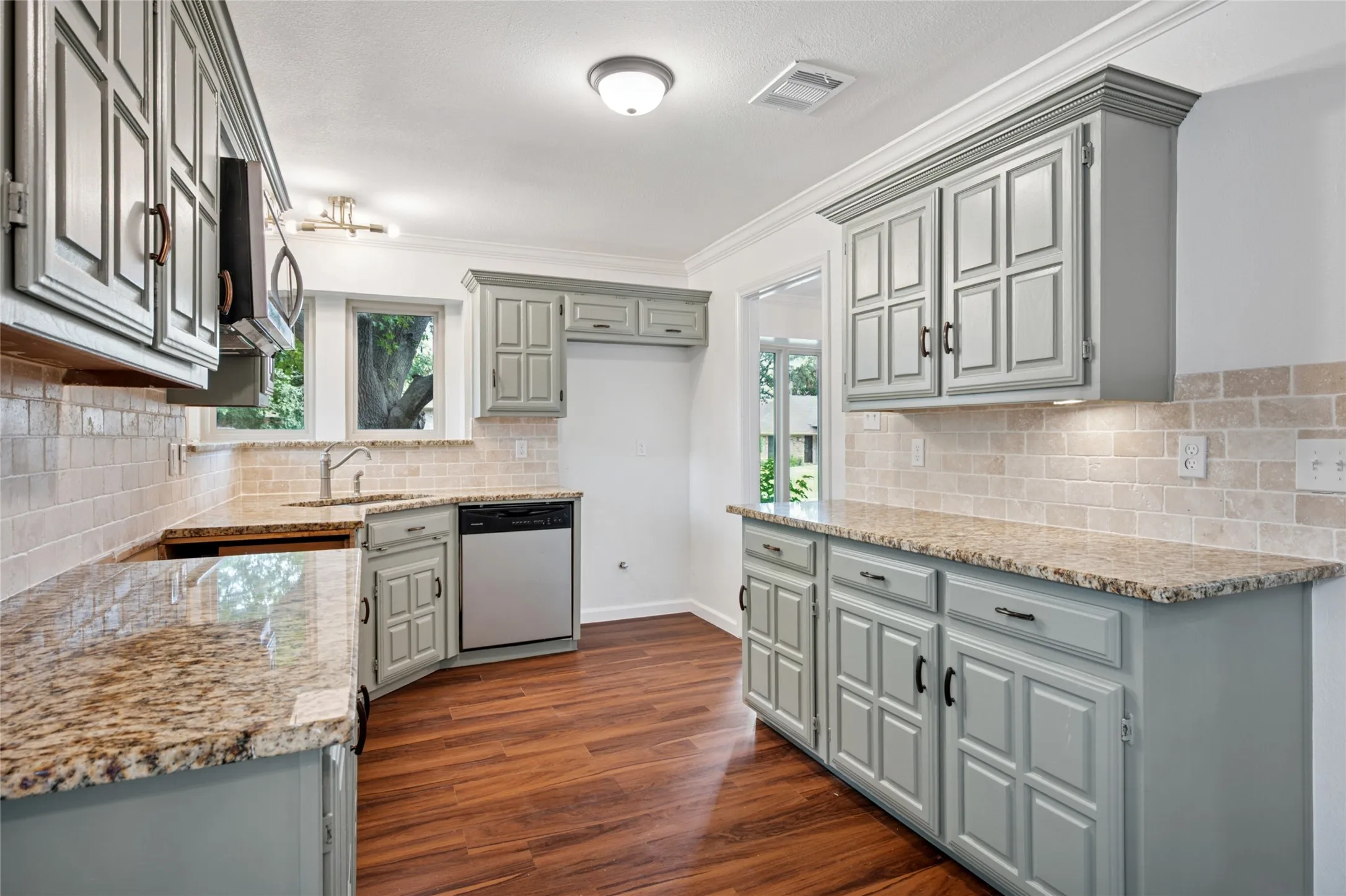 Kitchen with granite countertops. Range will be put in