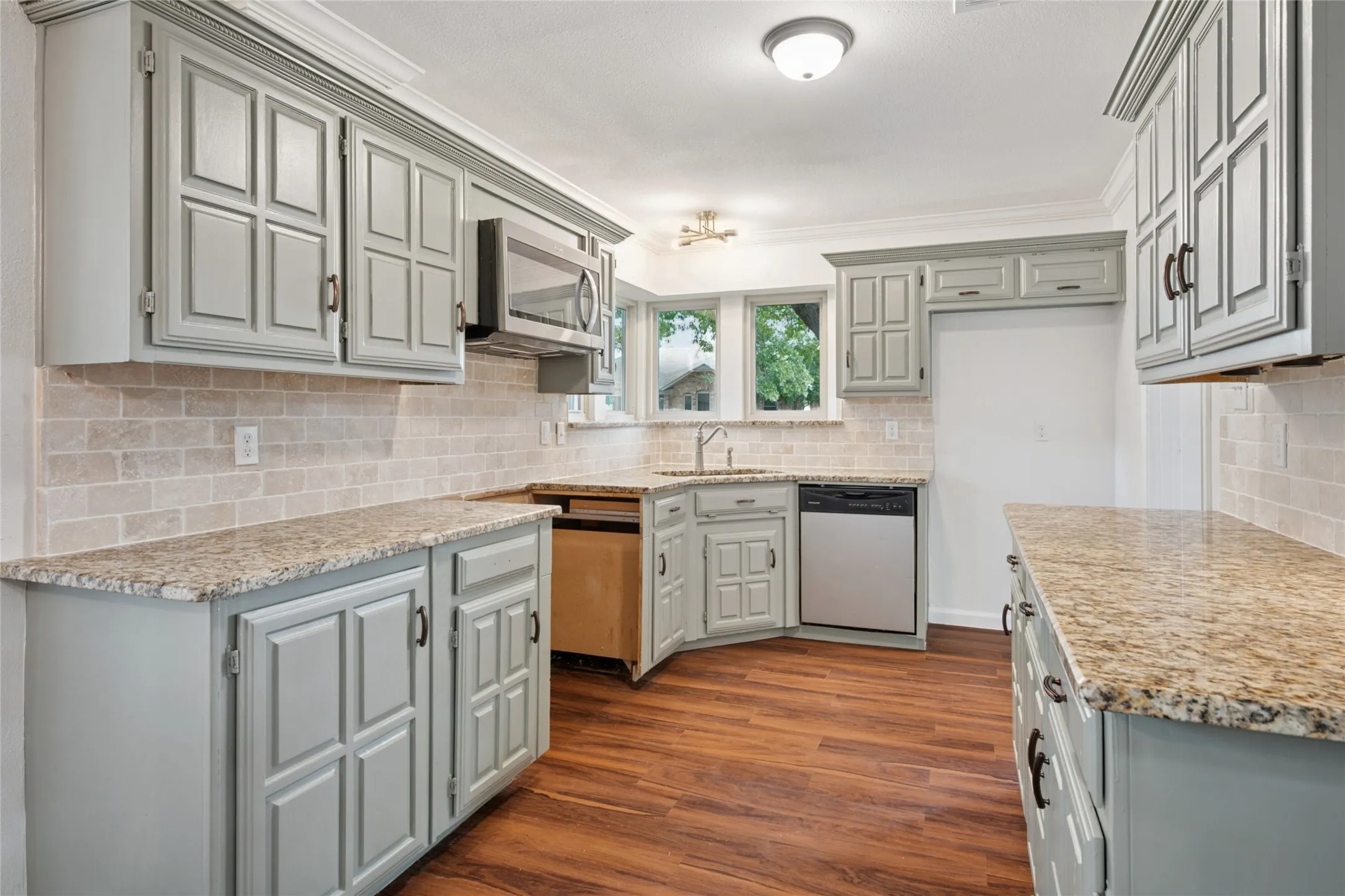 Kitchen with granite countertops. Range will be put in
