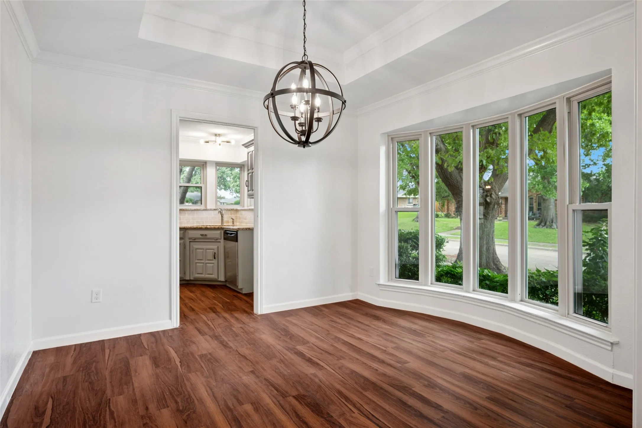 Dining room with bay window and updated lighting