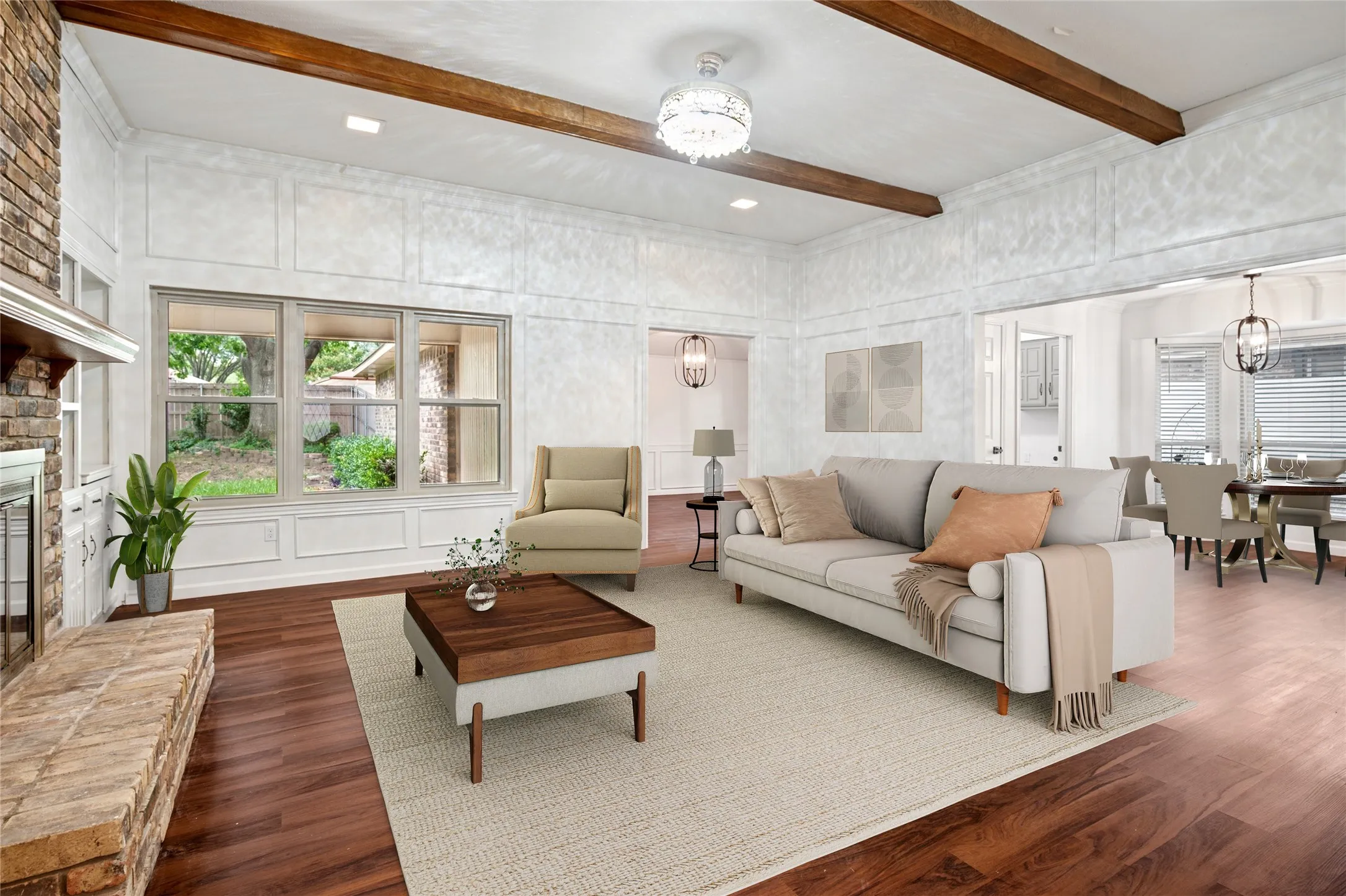 Staged family room with brick fireplace and built-ins