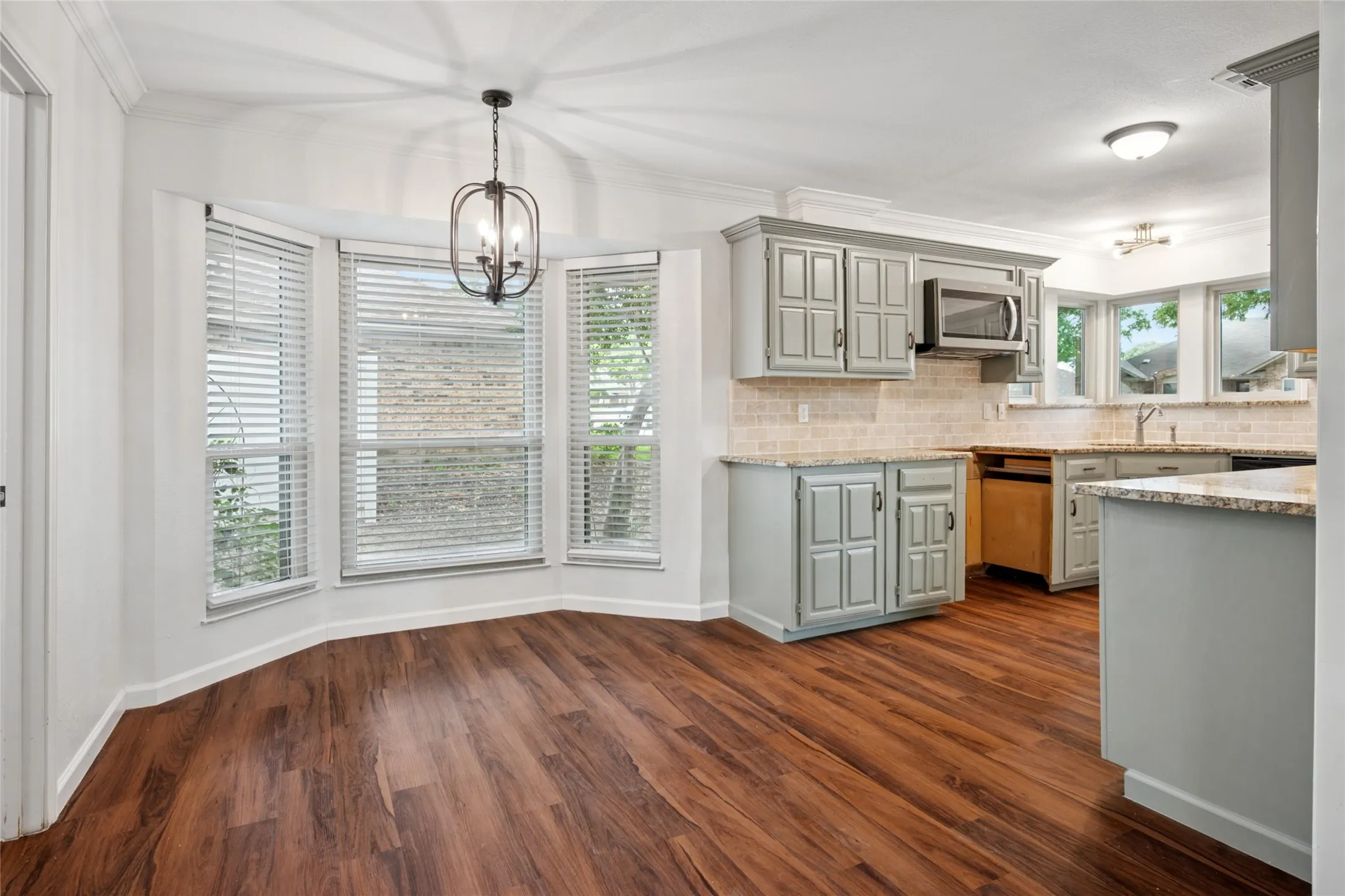 Breakfast room next to kitchen with bay window