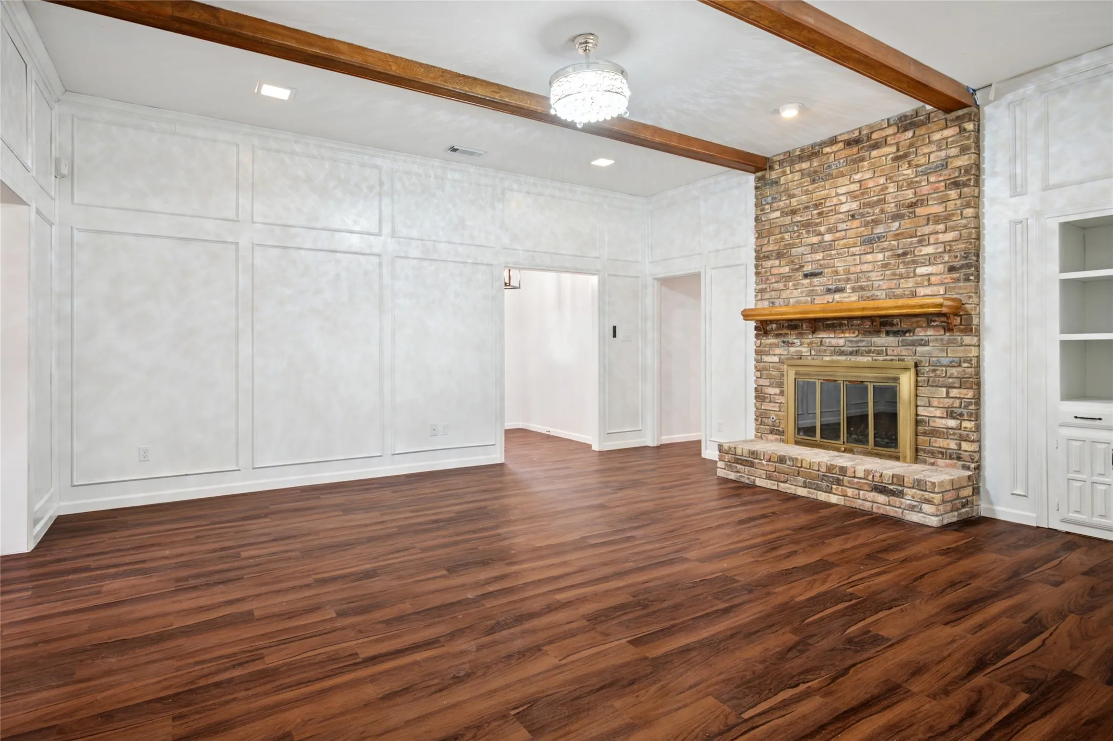 Family room with brick fireplace and built-ins