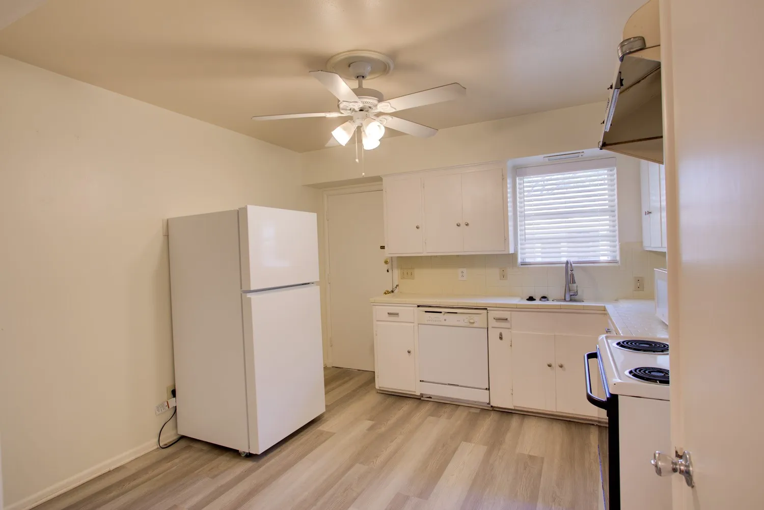 Full size washer/dryer connections in kitchen
