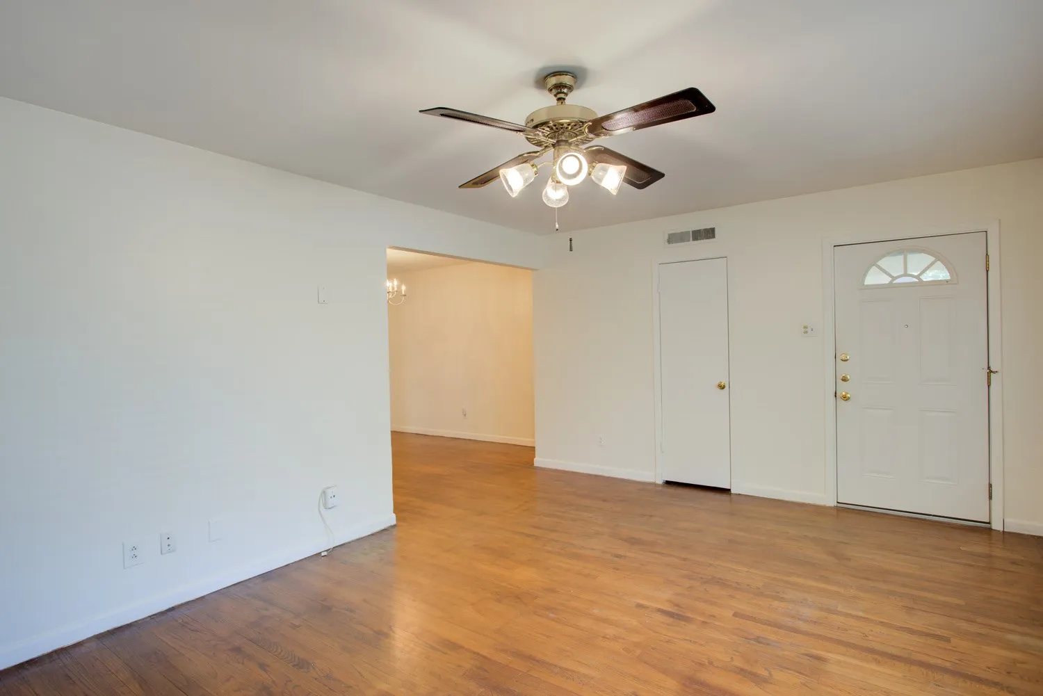 Front door in Living Room with coat closet