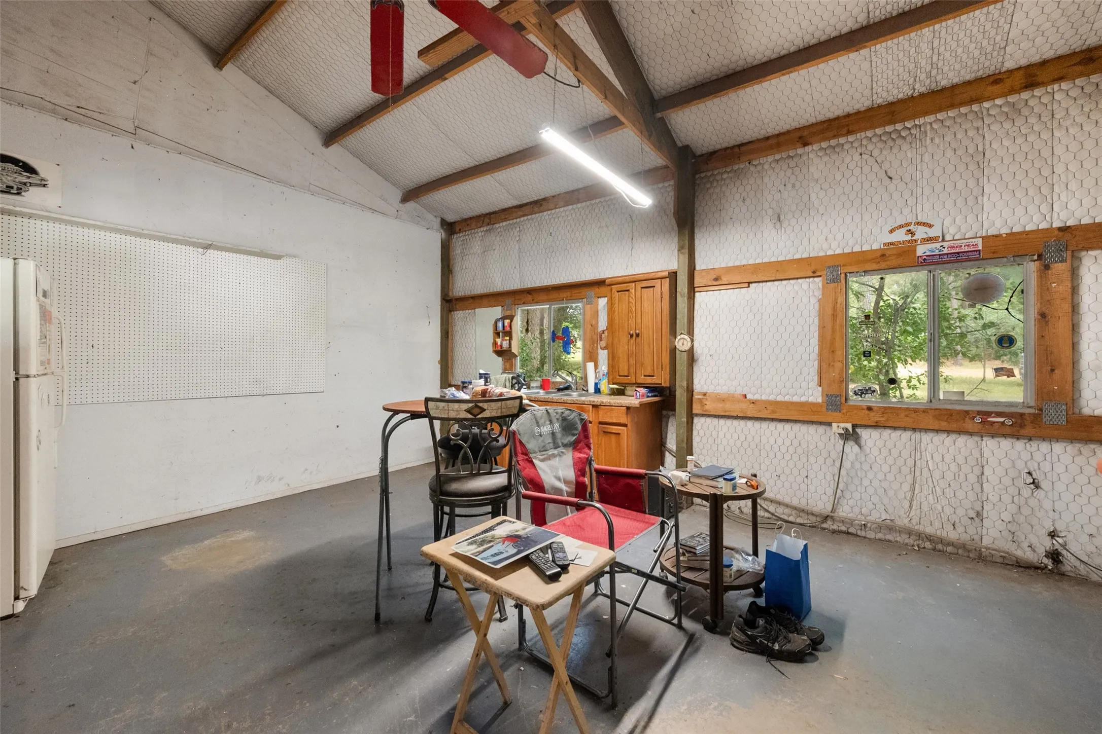 Separate office also has windows looking out towards the backyard area.