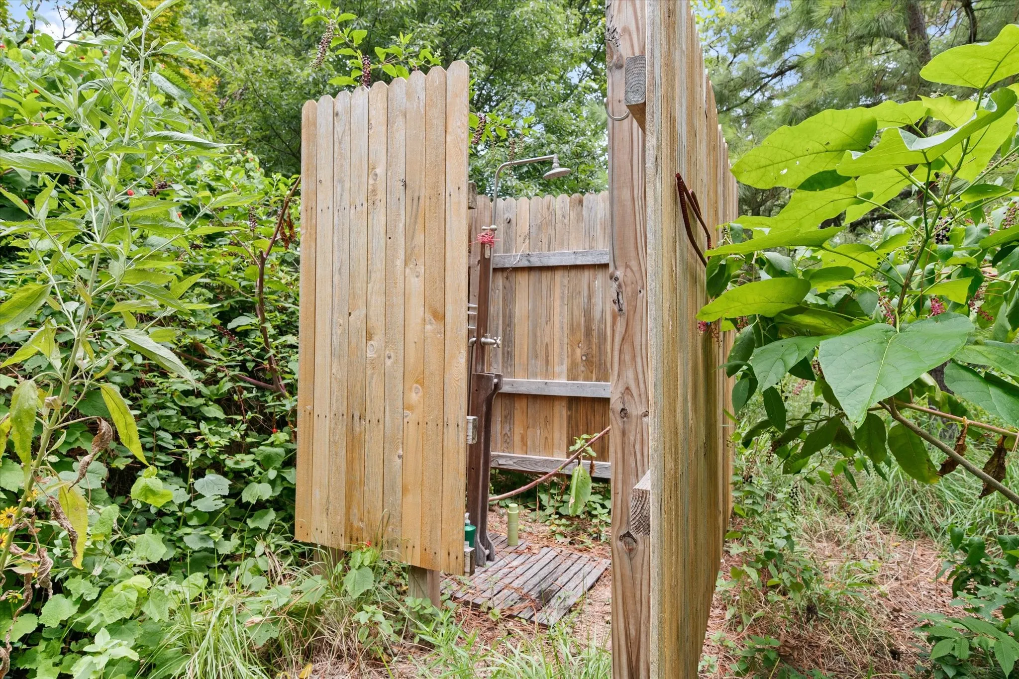 Outdoor shower in backyard.