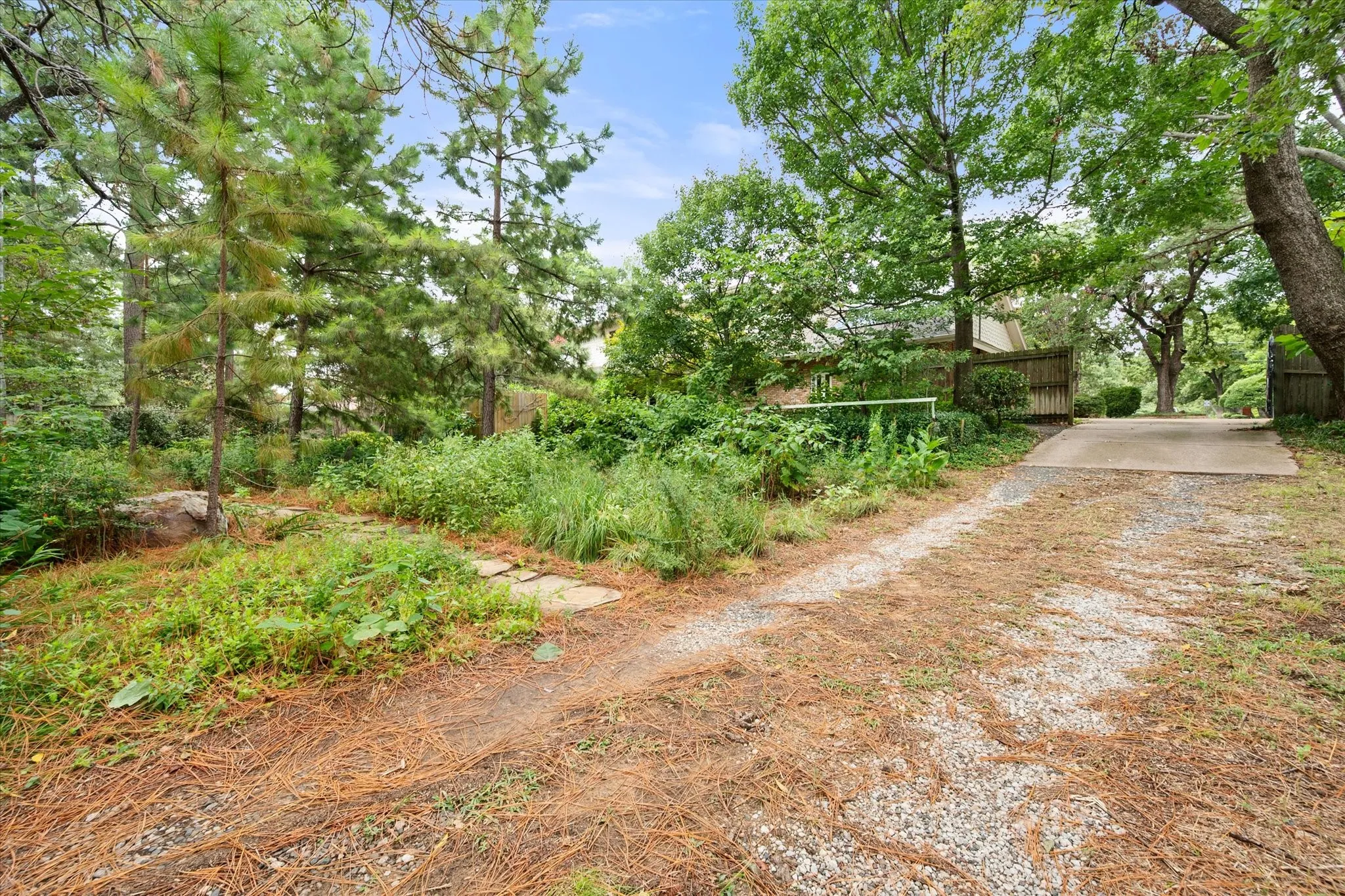 Driveway access to the back shop area.