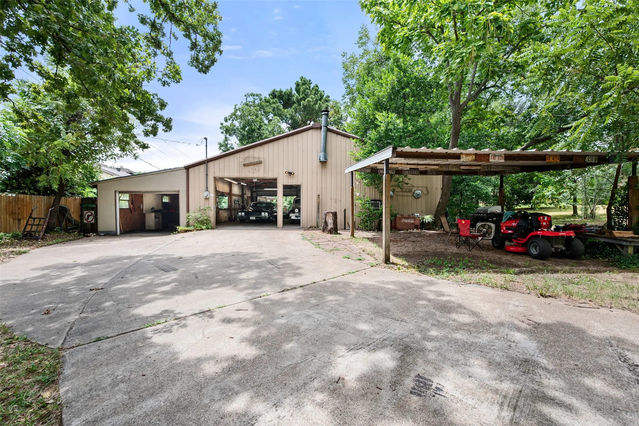 At the front of the Shop is an additional covered parking area providing space for at least 2 vehicles.