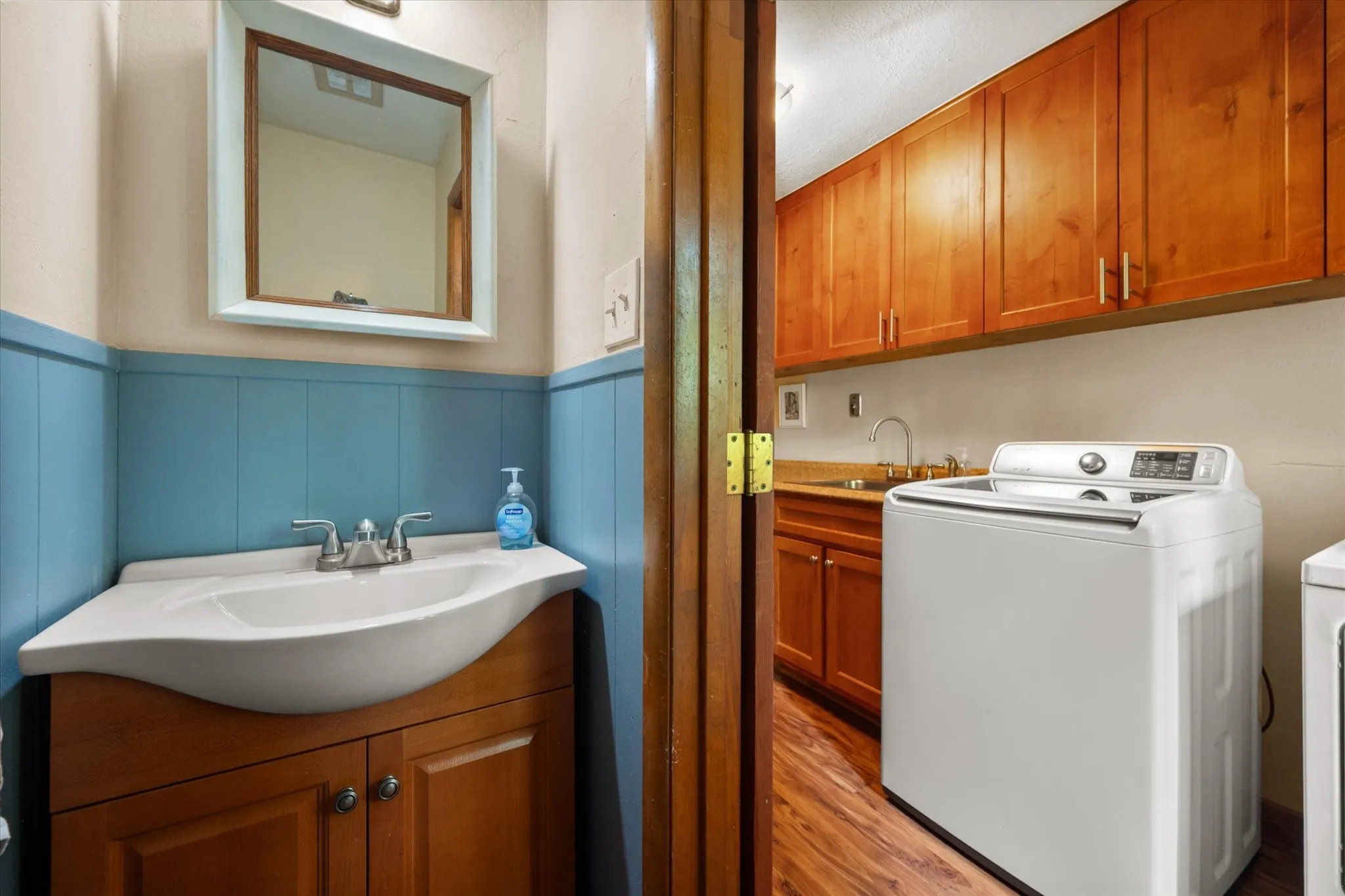Off the utility room is a conveniently located half bathroom.