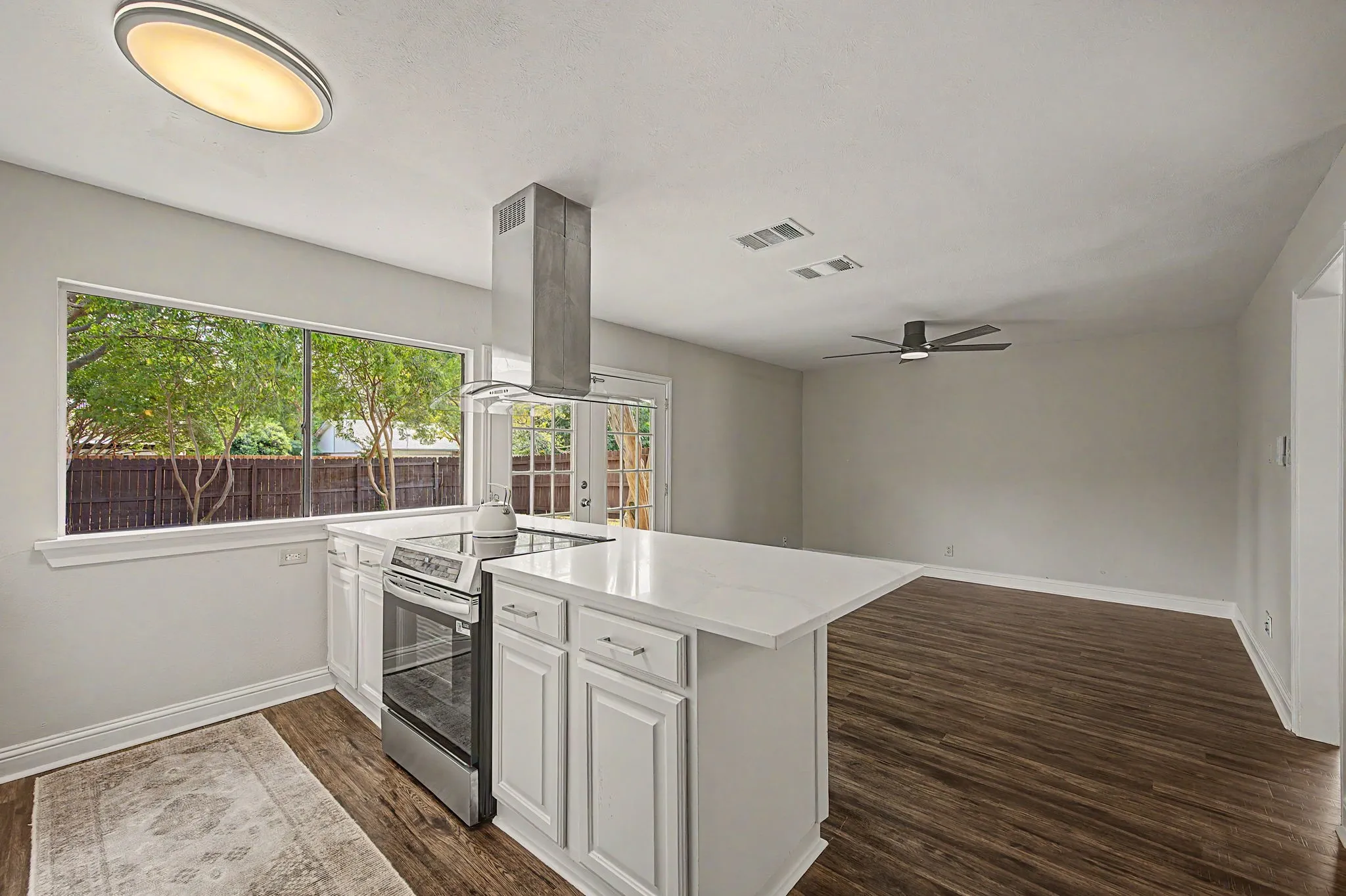 The kitchen is open to the 2nd living area.