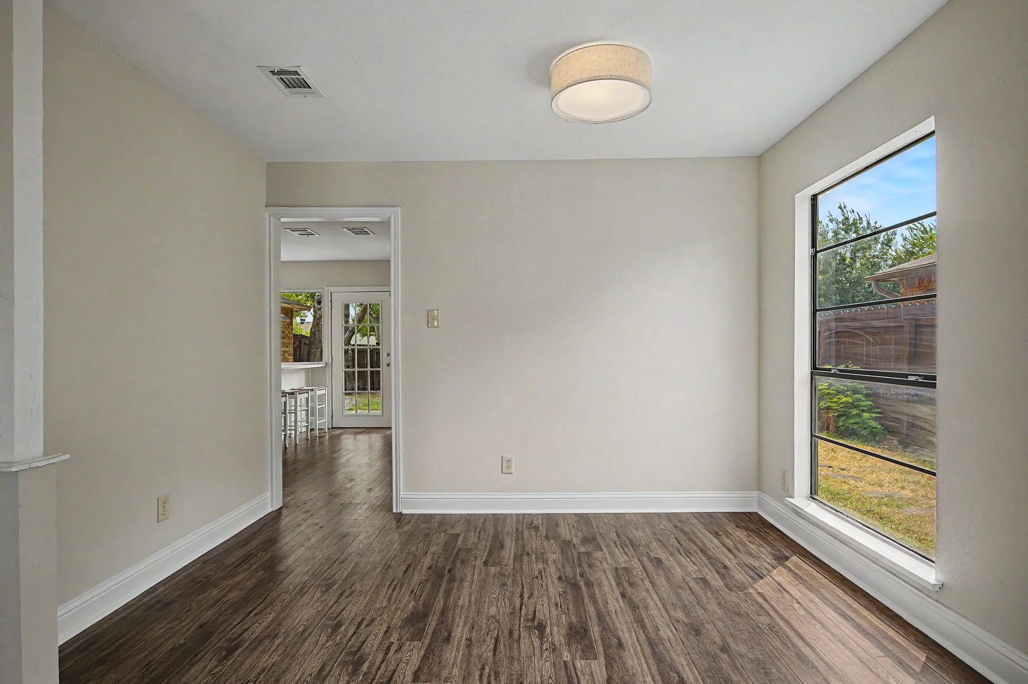 Living room opens to a formal dining room that is a flexible space and can be used for a play room, office and more!
