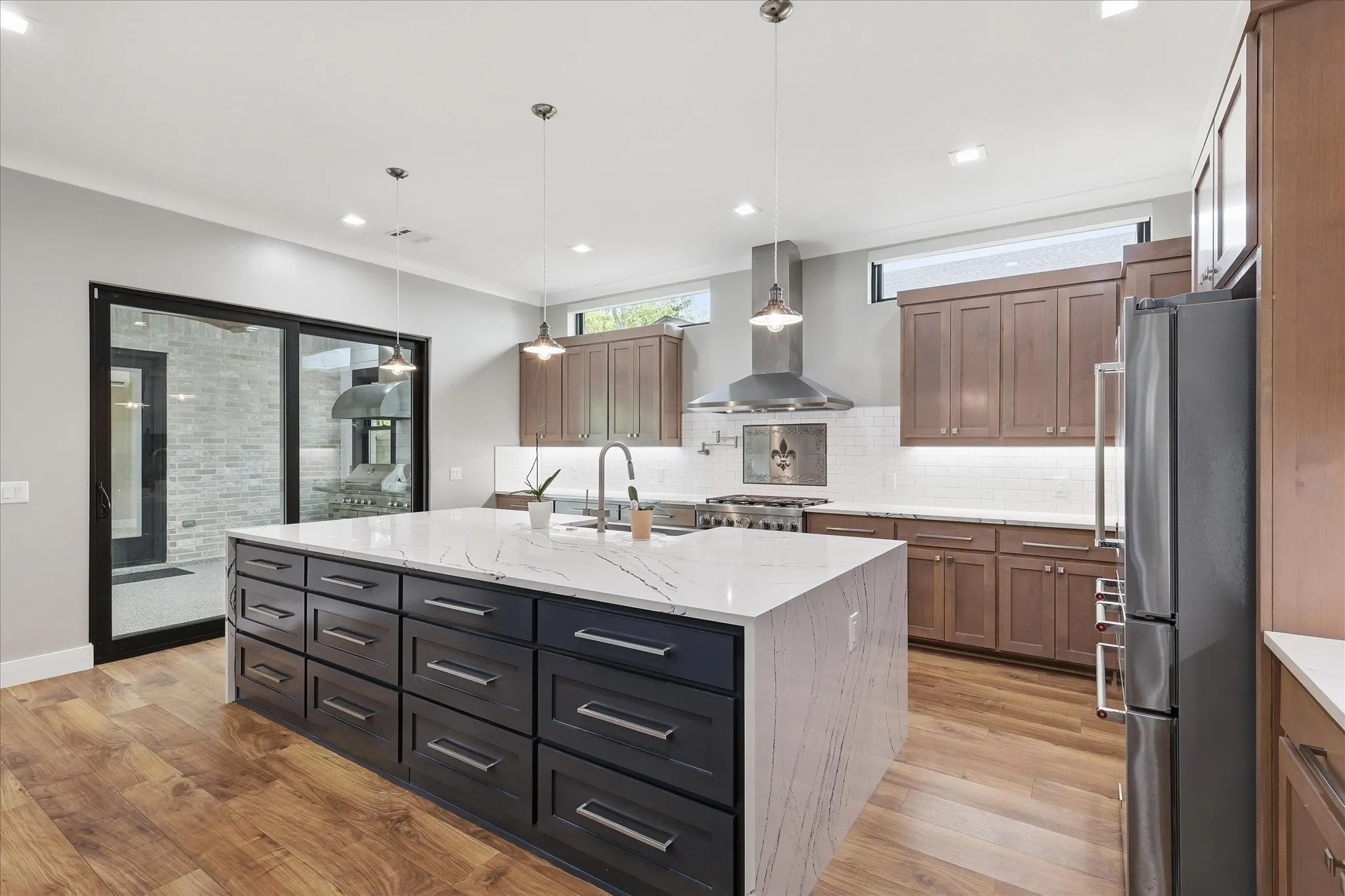 View of waterfall island and expanse of drawers