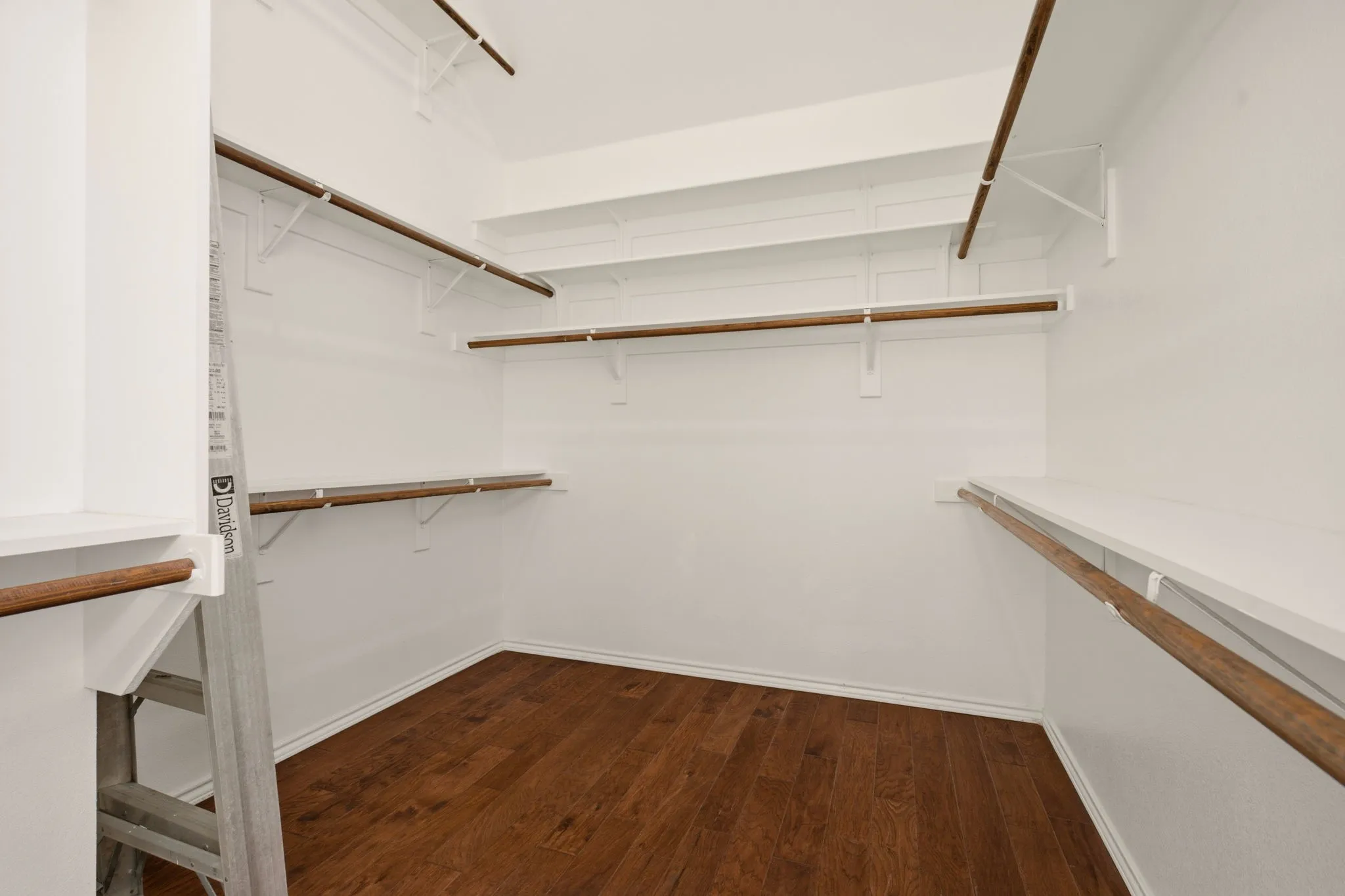 Primary closet has wood floor too!