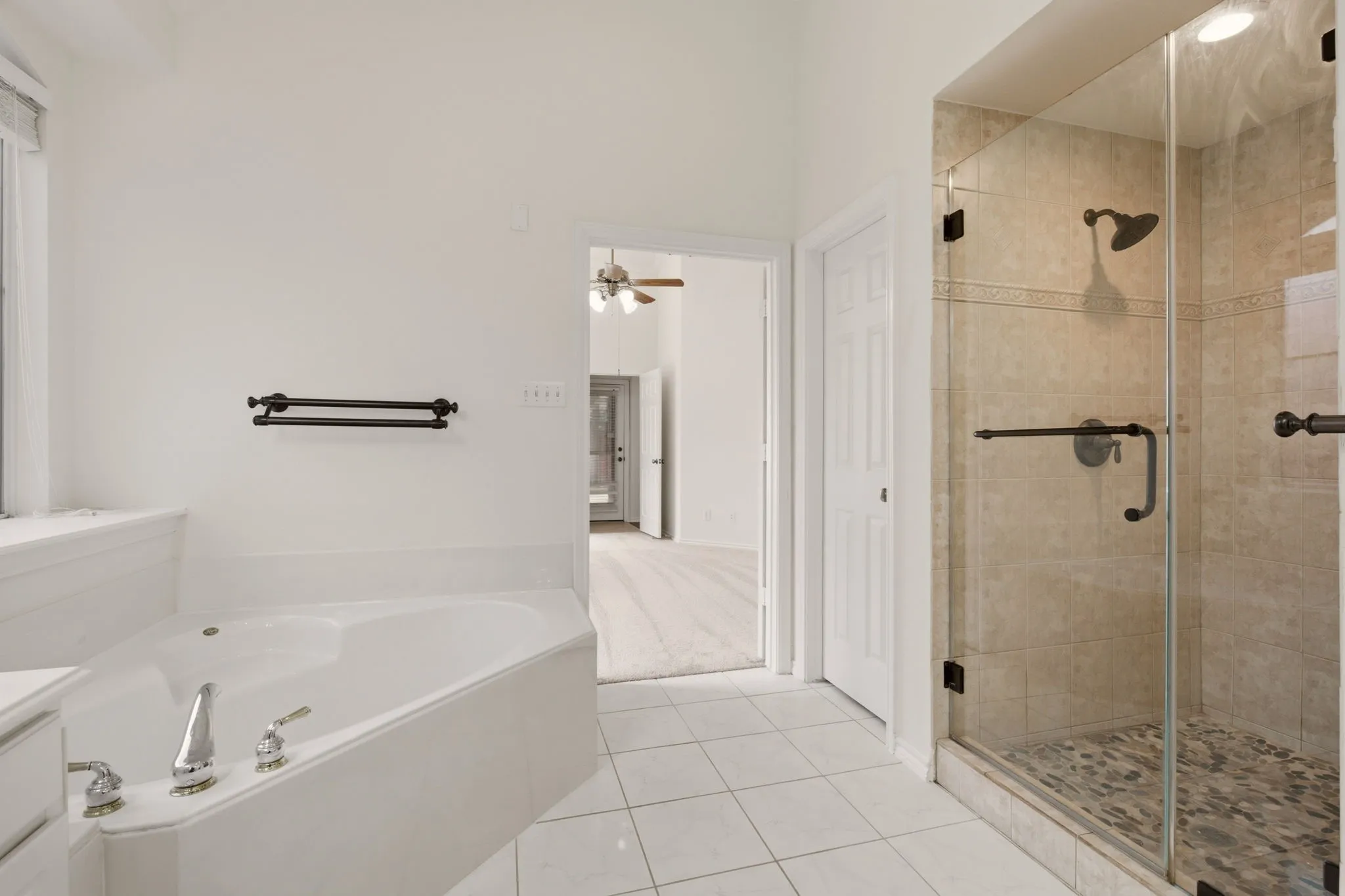 Primary bath garden tub & frameless shower.