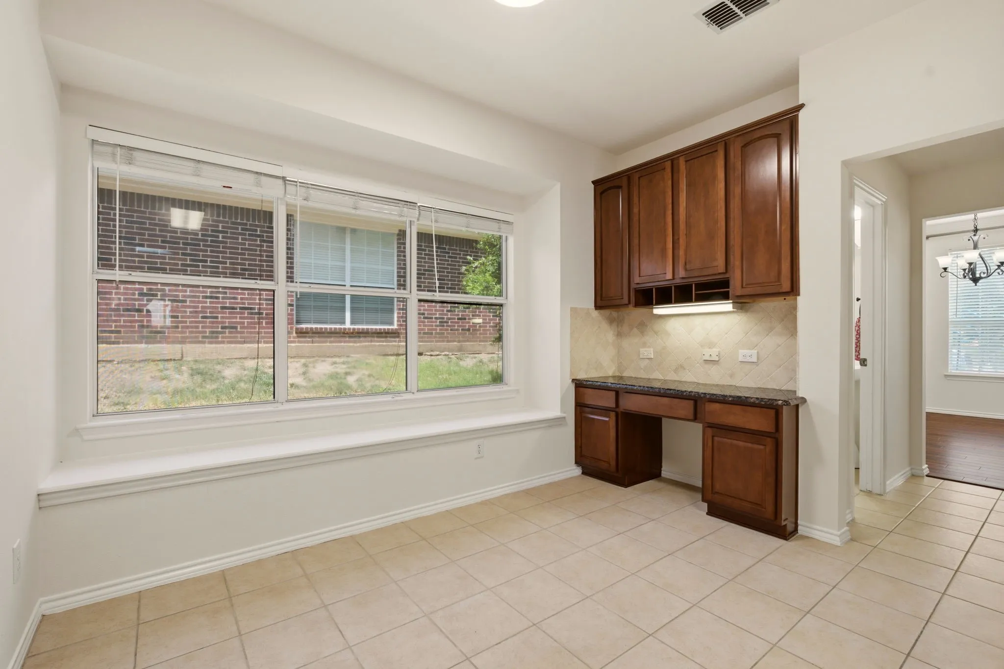 Love the window seat & handy desk for homework or family organization.