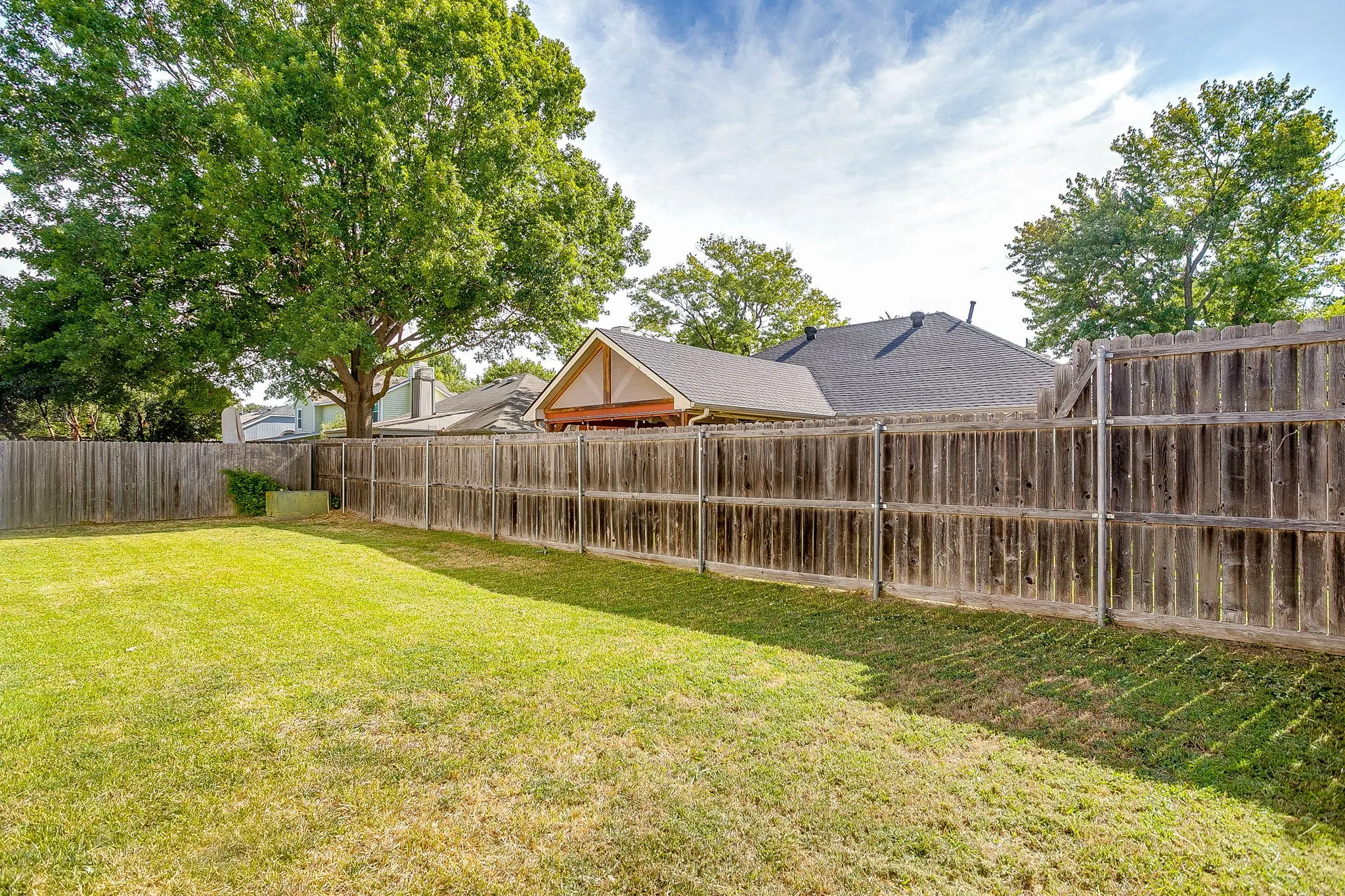 Fully fenced backyard.