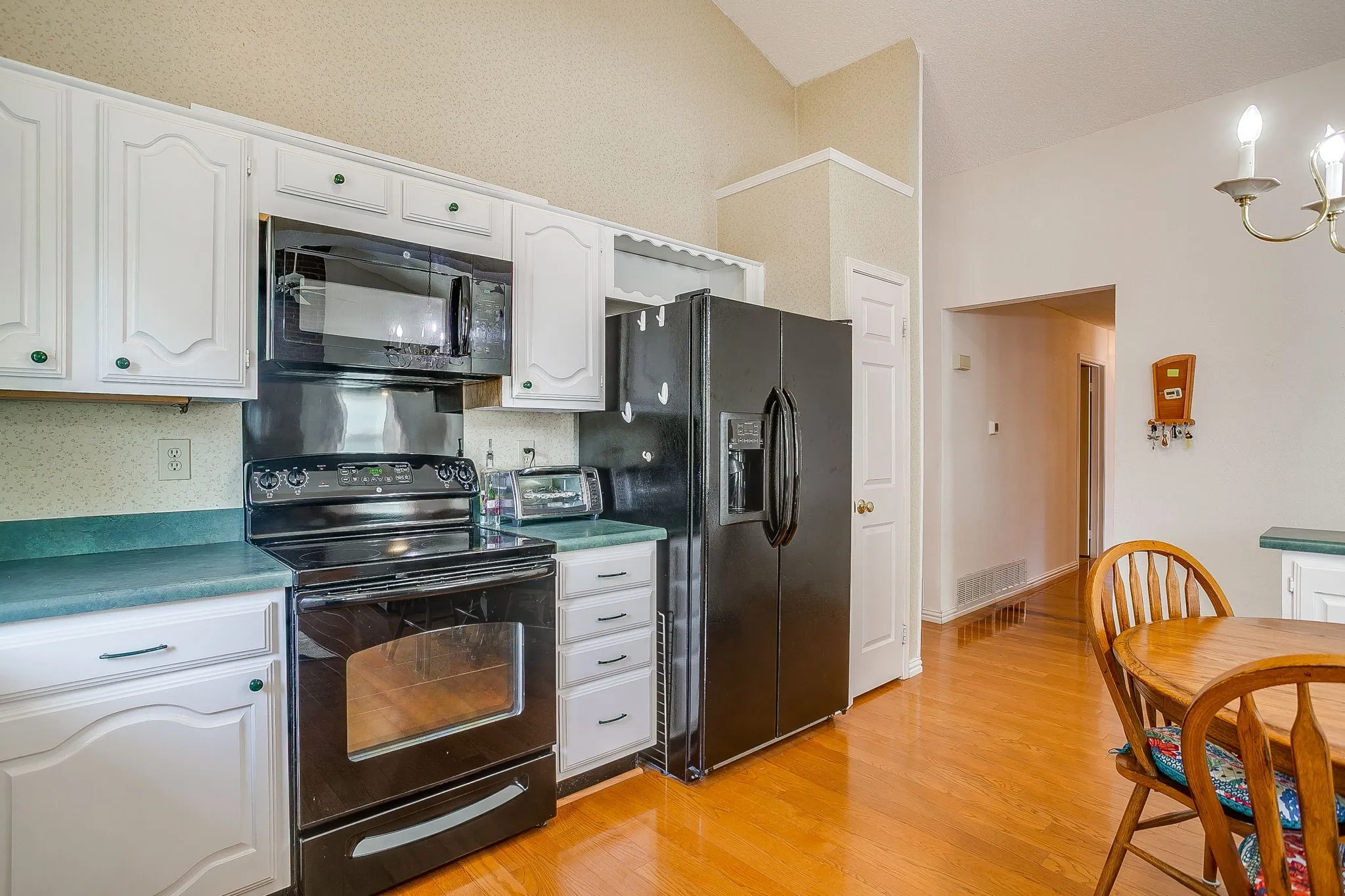 Spacious kitchen with ample storage.