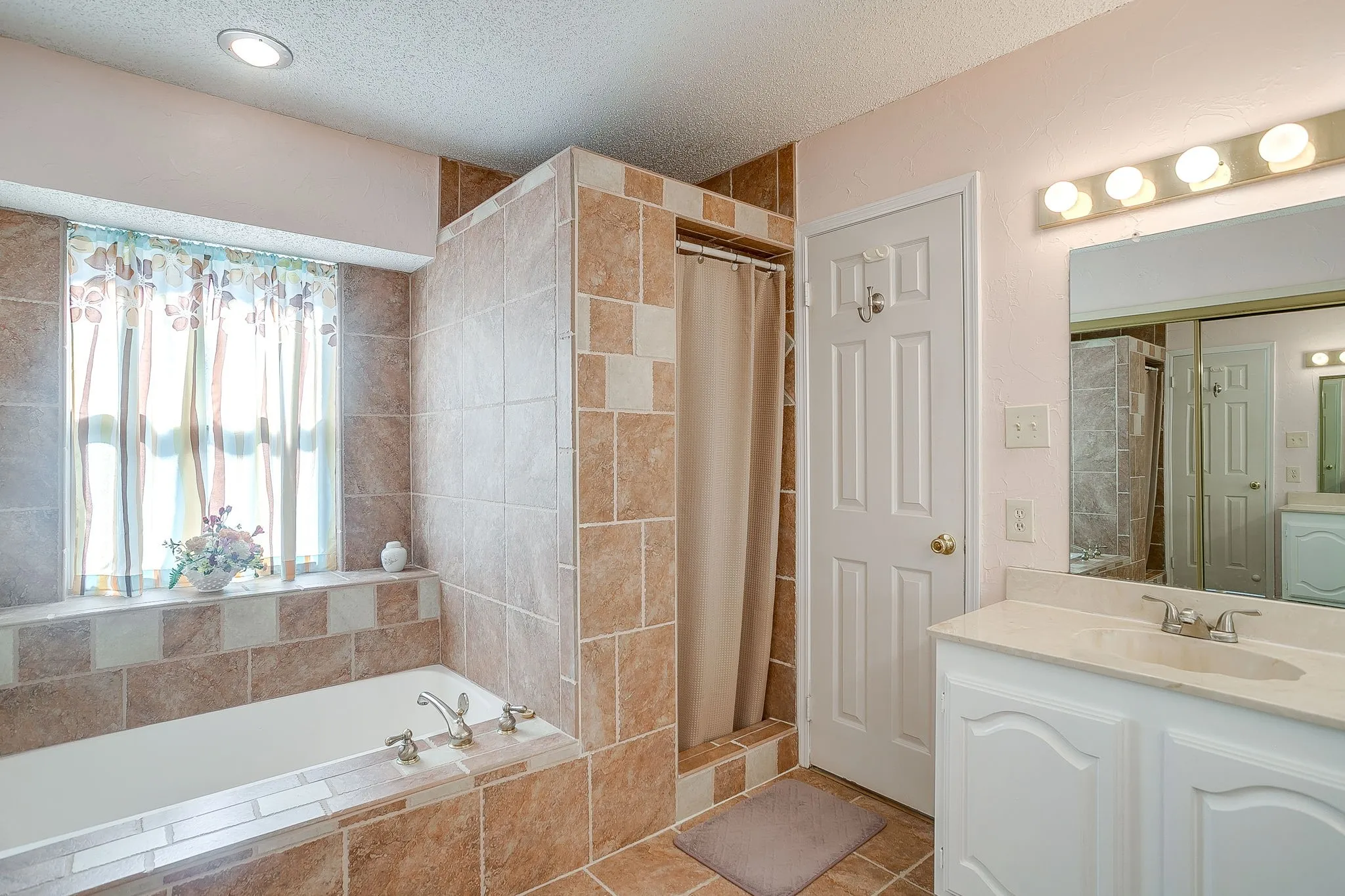 Gorgeous ensuite bathroom with separate tub and shower space.