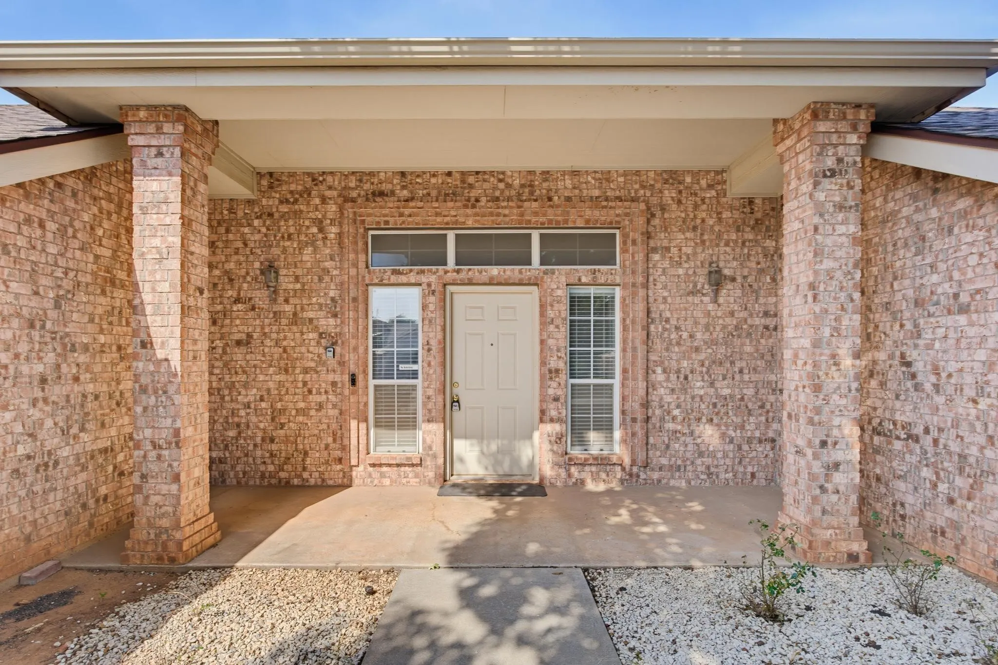 Brick exterior with covered entry