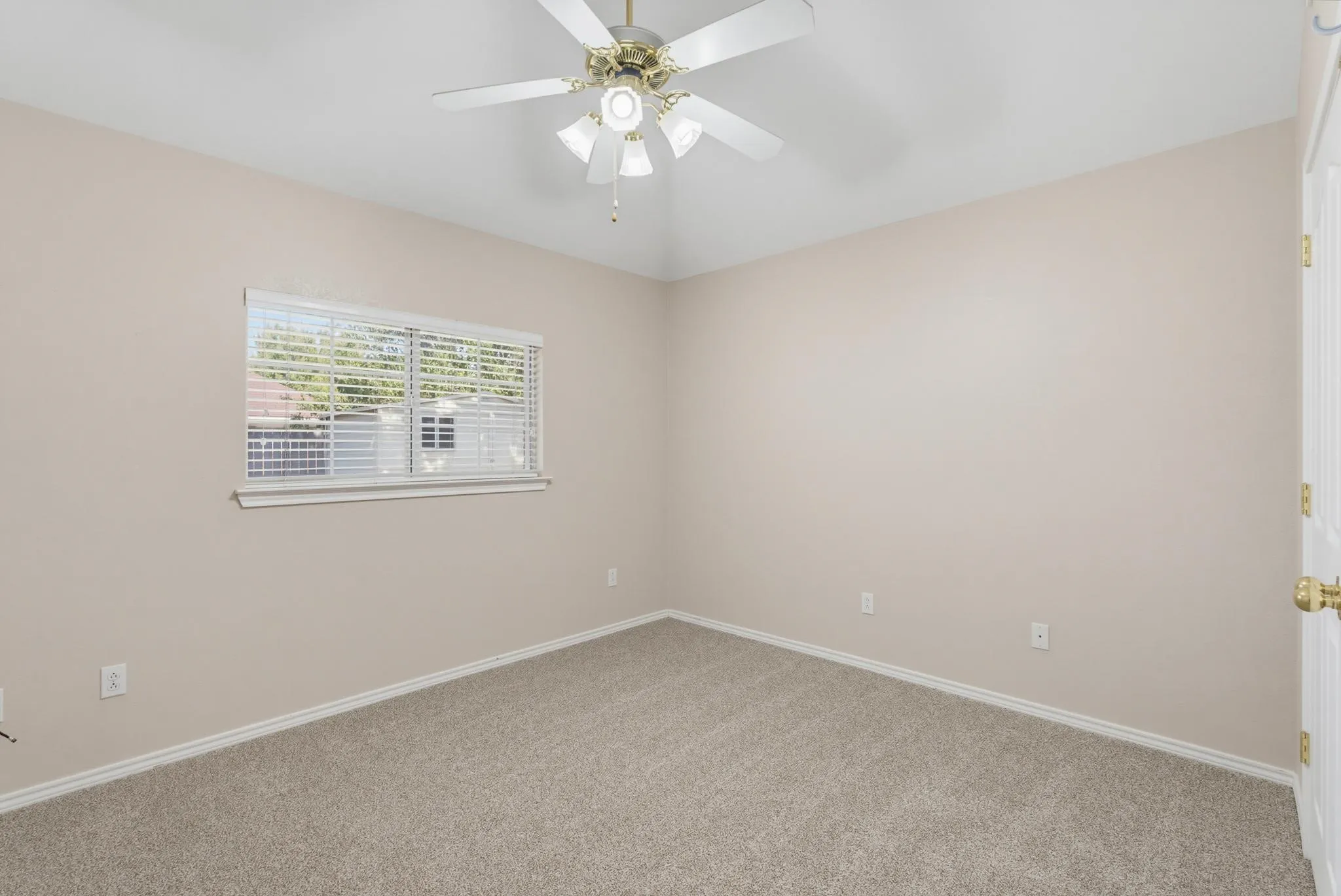 Neutral-toned carpeting paired with light-colored walls