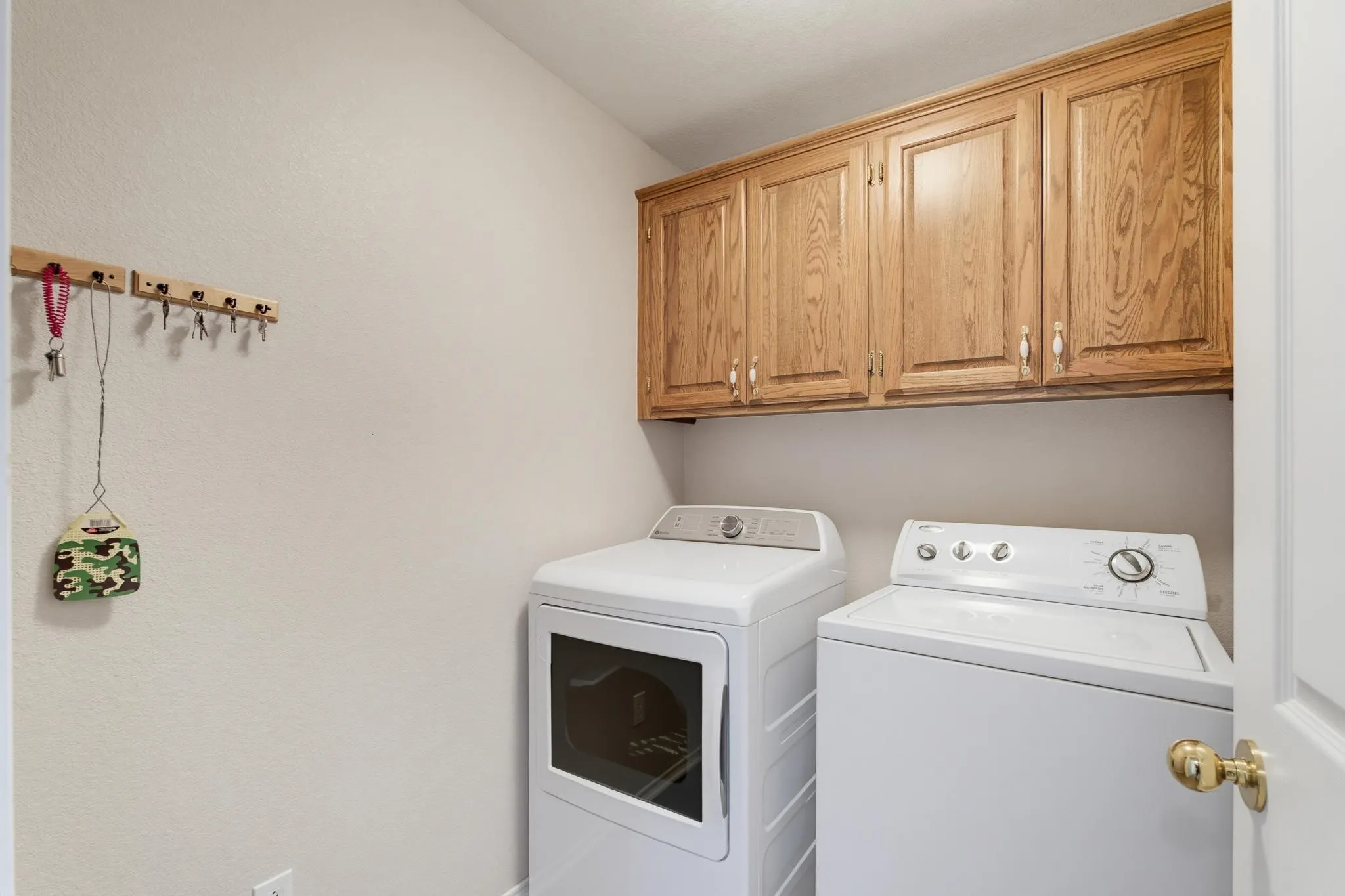 Upper cabinetry with wood-finish doors