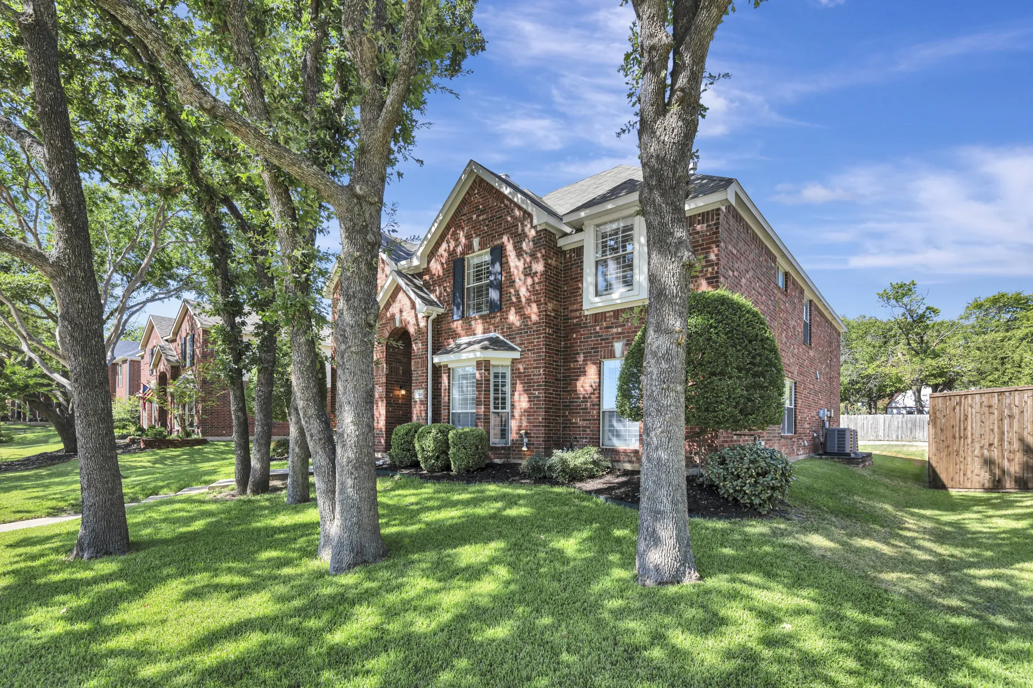 Brick exterior with a gabled roof and white trim