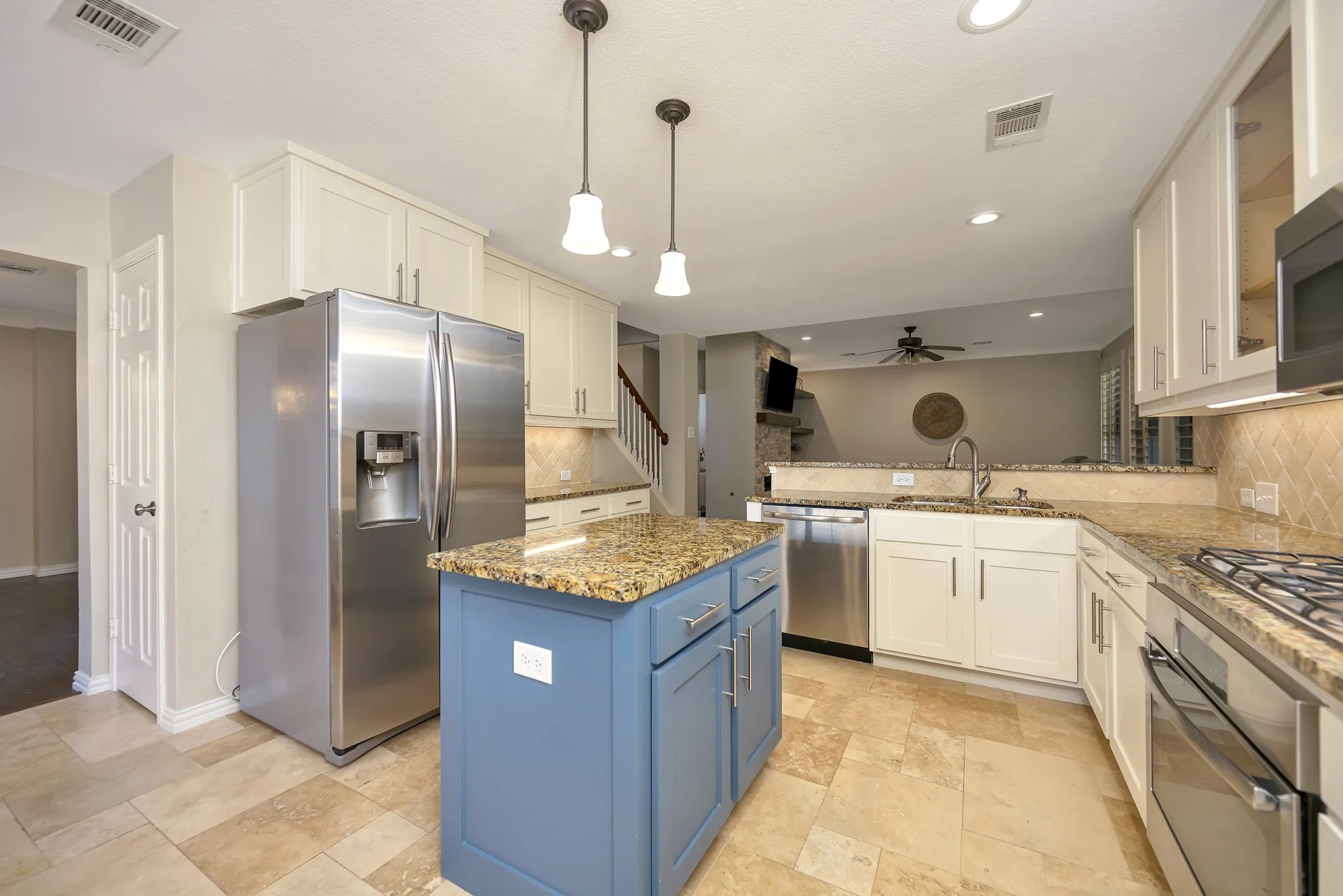 Kitchen featuring a central island, recessed lighting, and pendant lighting