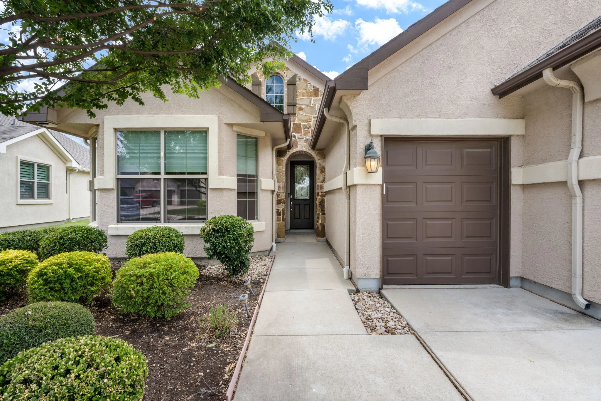 Covered entryway and golf cart garage