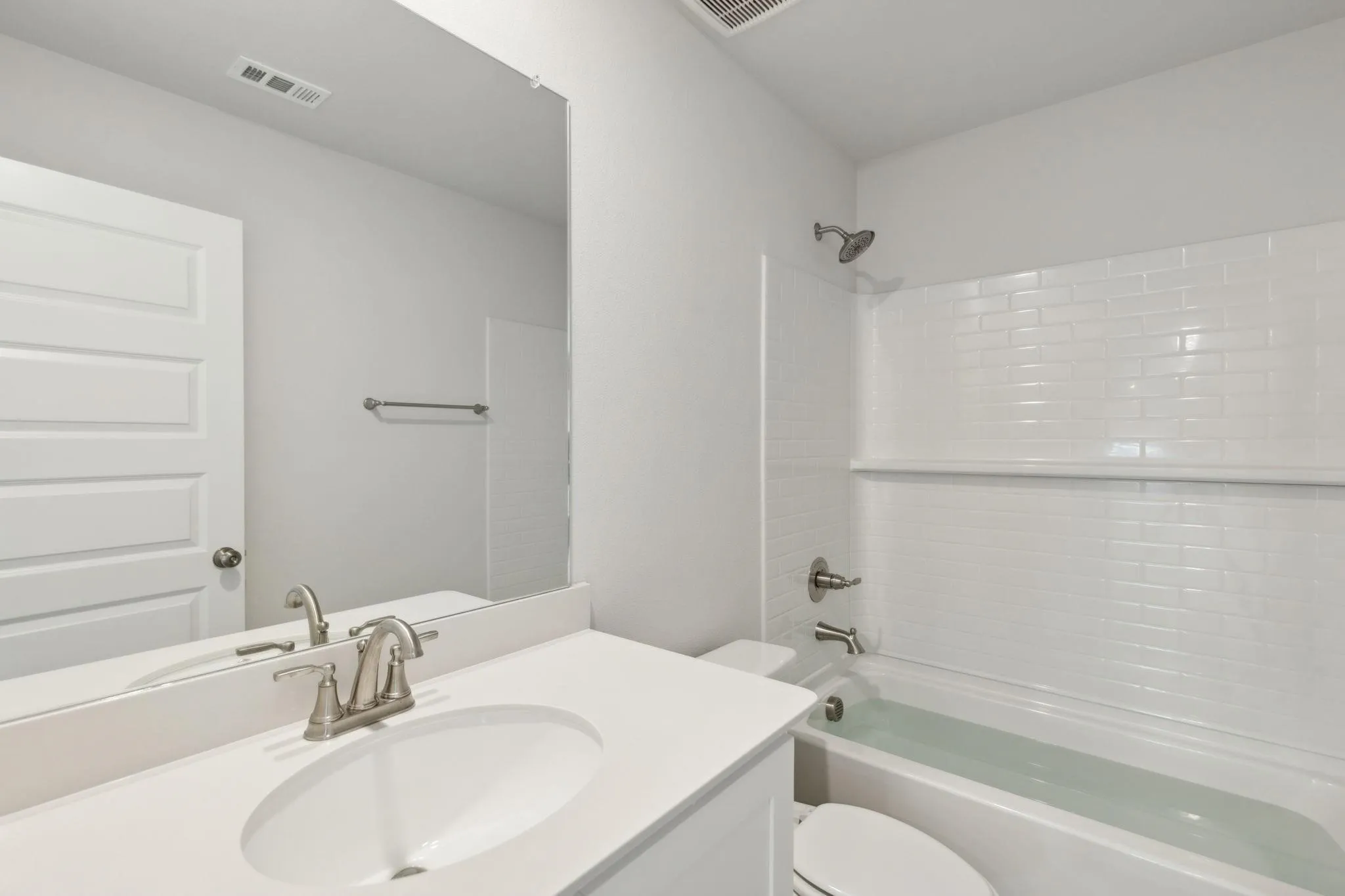 Full bath featuring toilet, shower / bathtub combination, and vanity