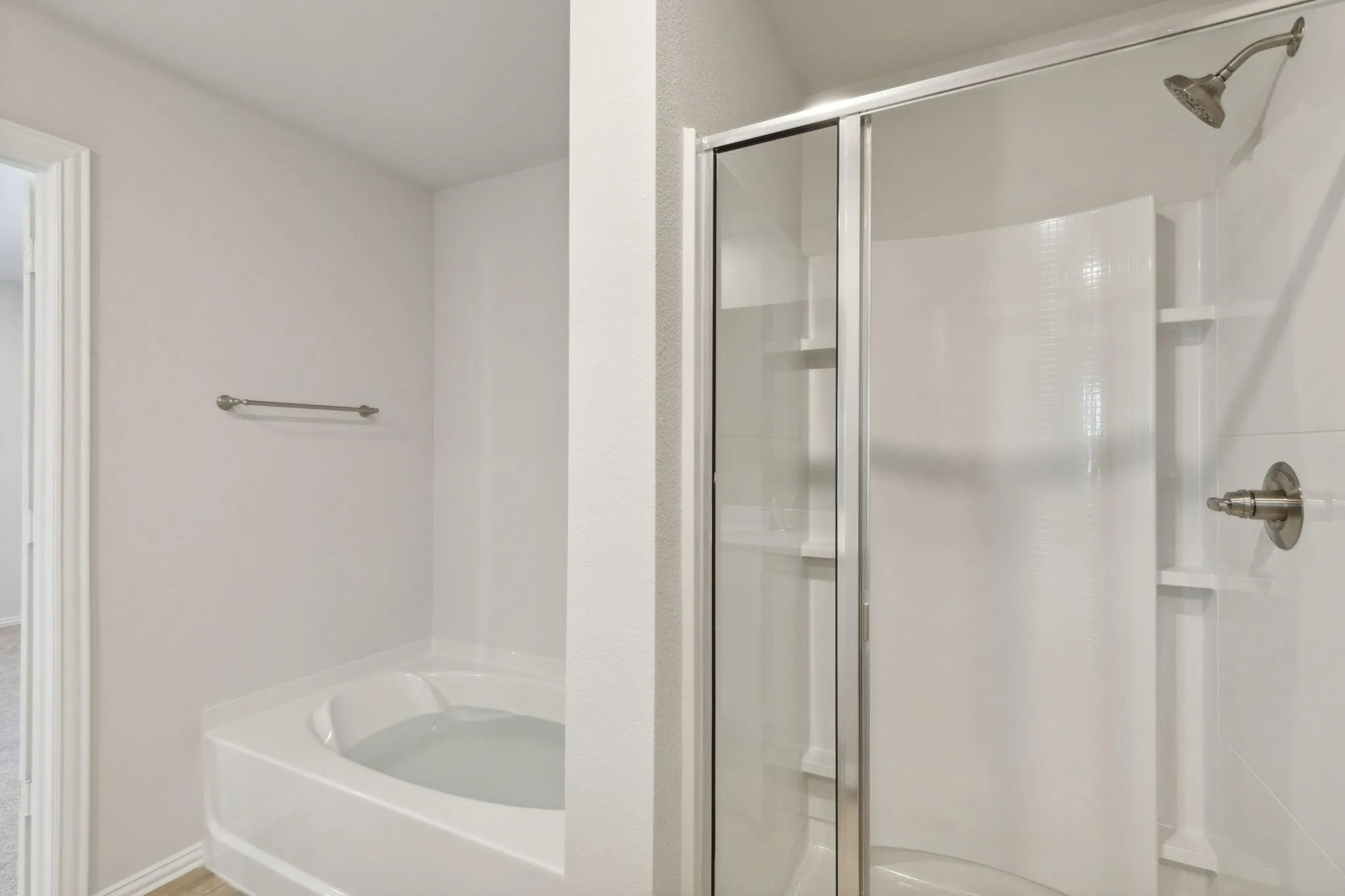 Full bath with a shower stall and a bath