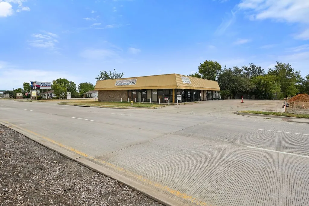 Commercial building featuring a flat roof and brick exterior