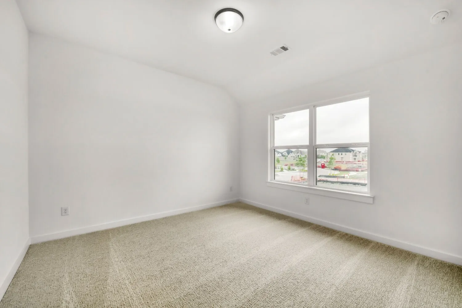 Neutral color palette, window with exterior elements, carpet flooring, flush mount ceiling fixture, and white trim