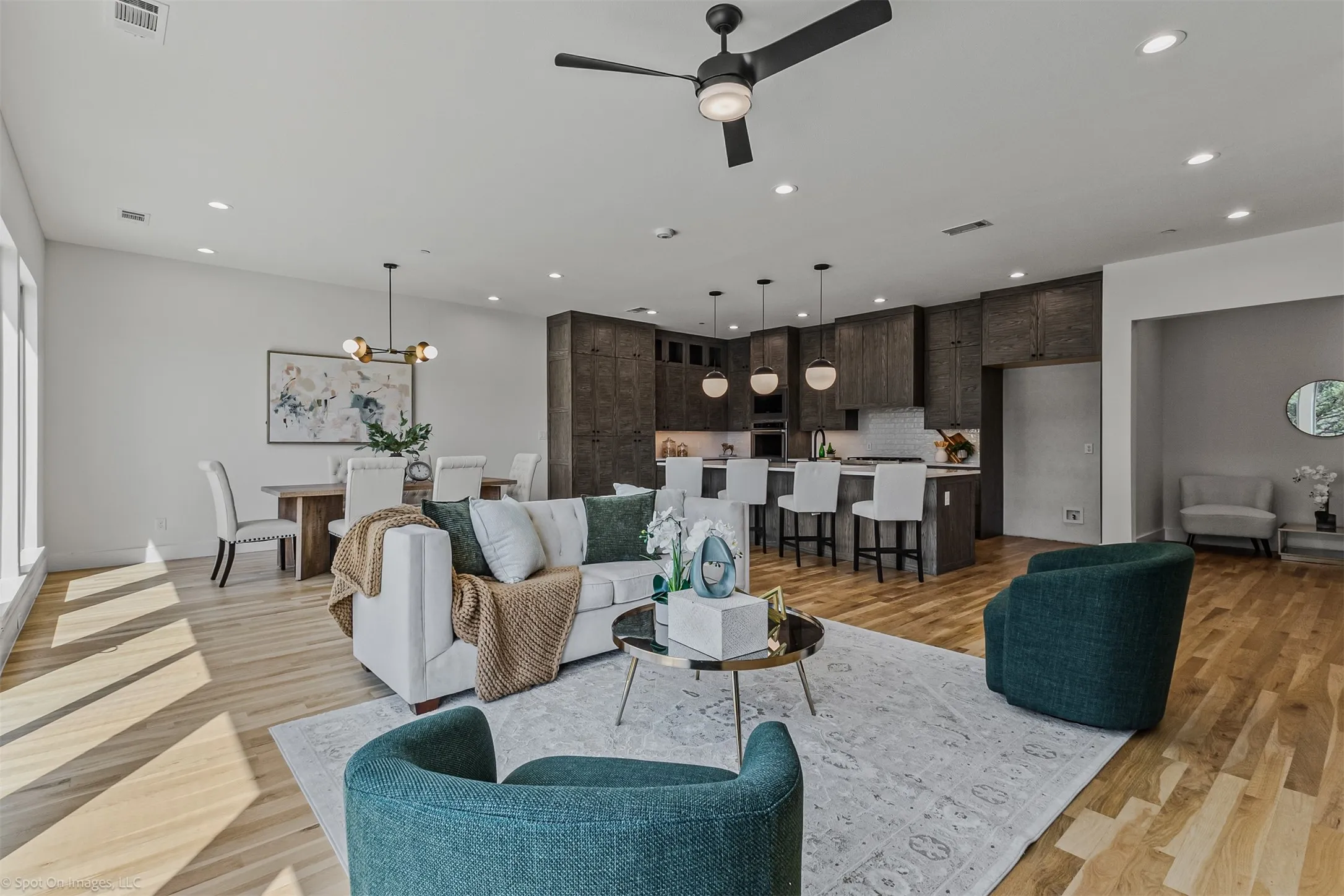 Open-concept living space with wood-finish flooring