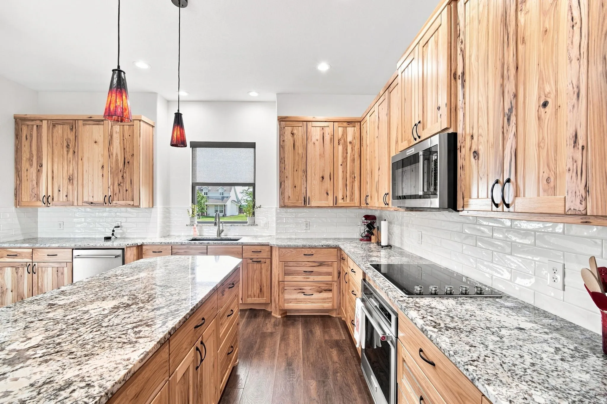 Spacious kitchen with ample cabinetry and generous workspace.