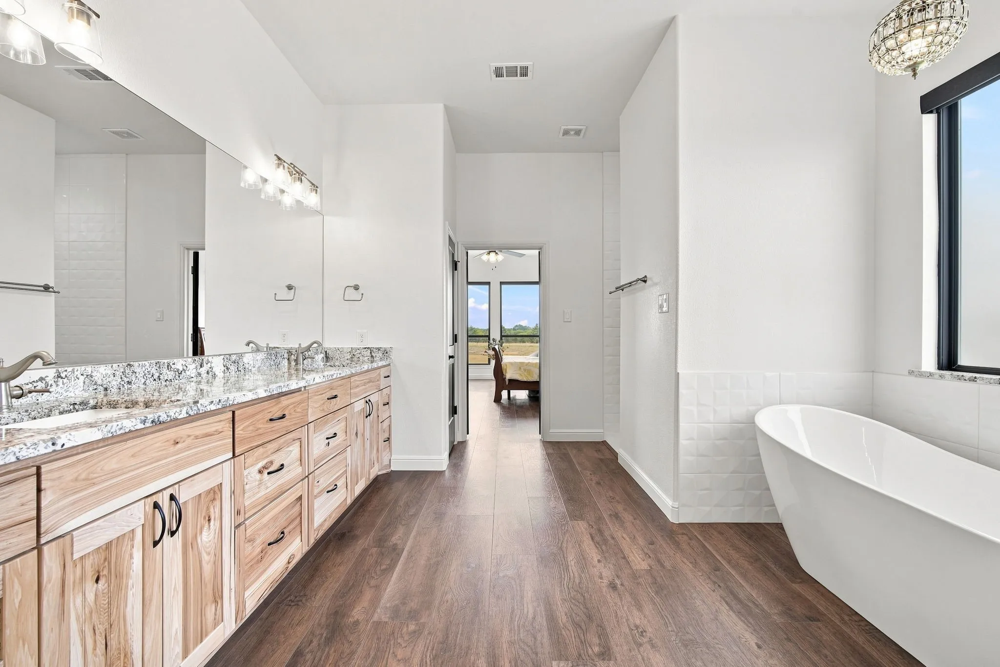 Spacious primary bath designed for comfort and convenience.
