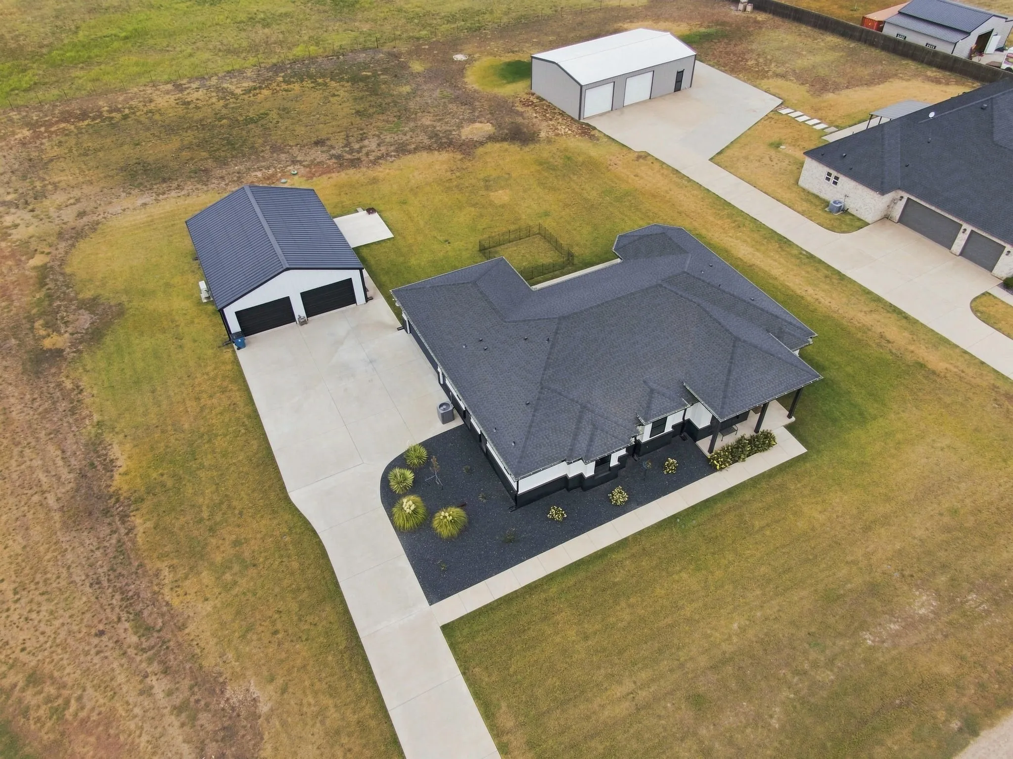 Aerial view showcasing the expansive 1-acre property.