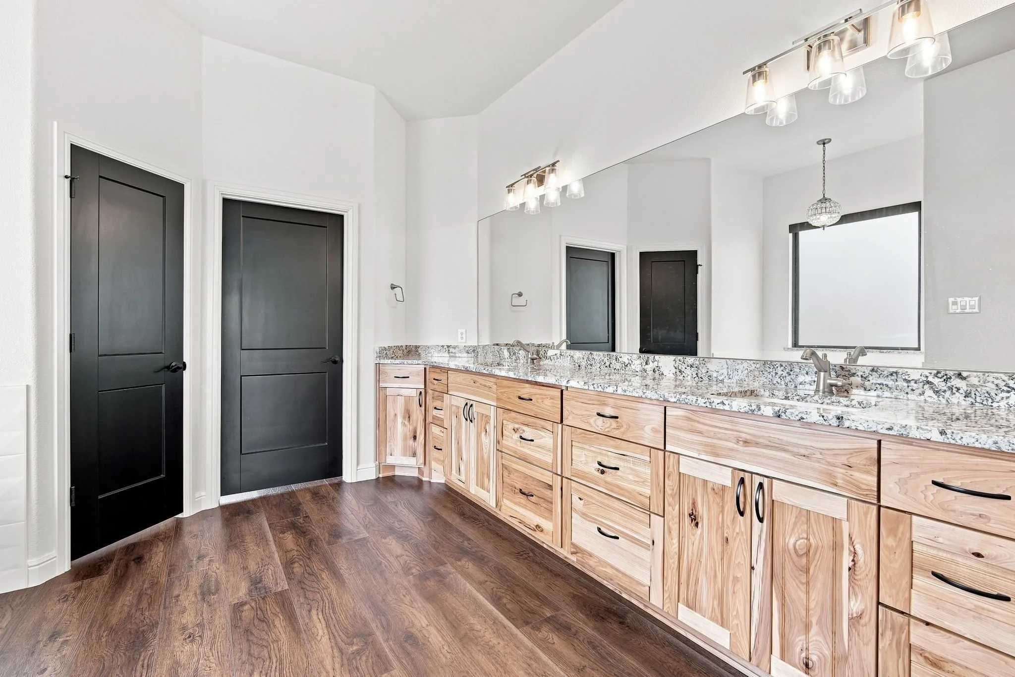 Beautifully designed primary bath with a comfortable, functional layout.