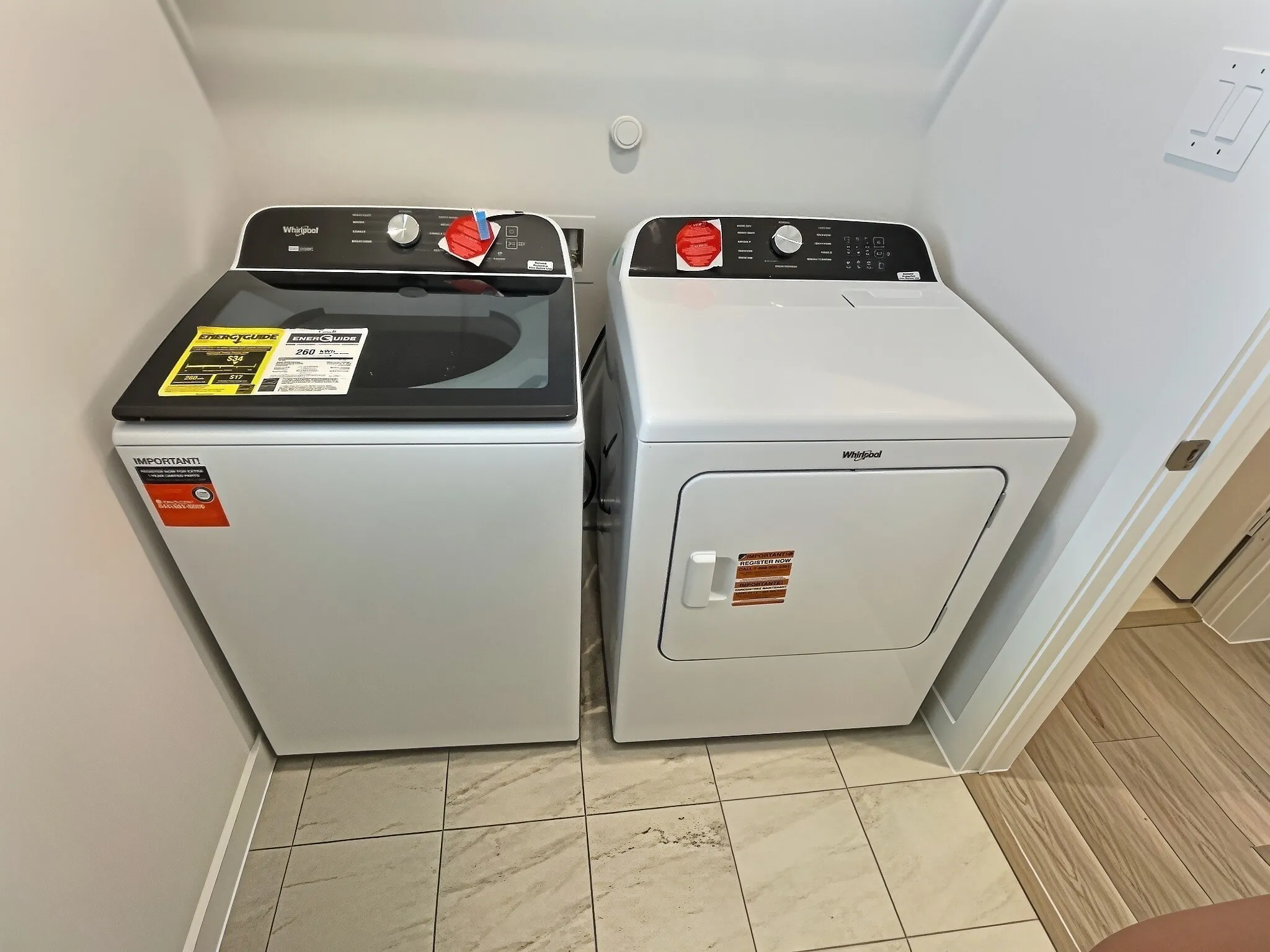 Washer and dryer set with a top-load washer and front-load dryer