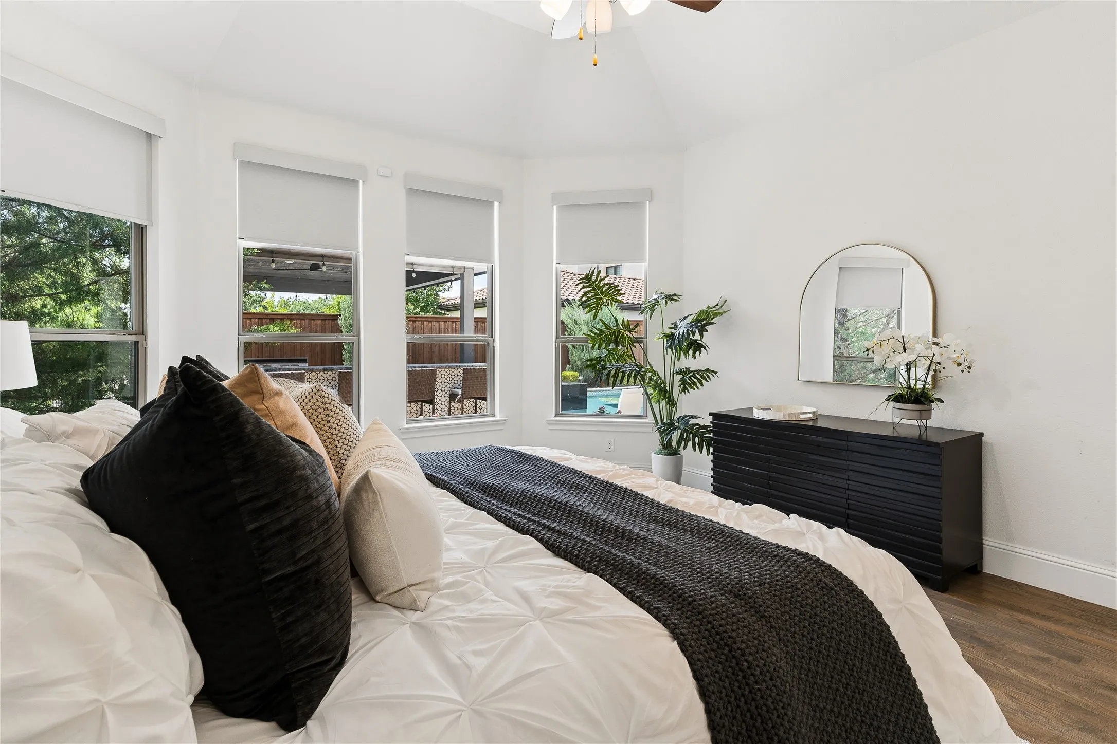 Private primary retreat overlooking the backyard with spa like ensuite and architectural ceiling details