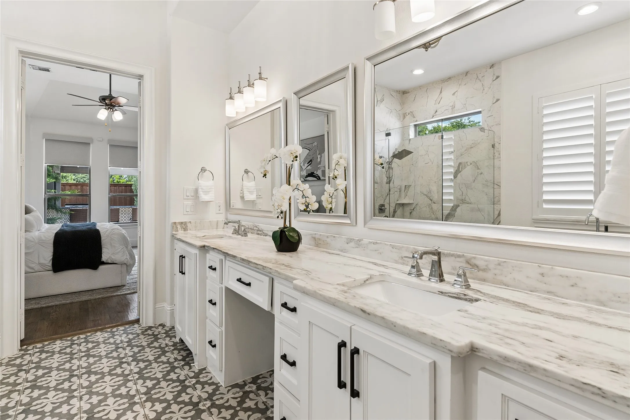 Private primary retreat overlooking the backyard with spa like ensuite and architectural ceiling details
