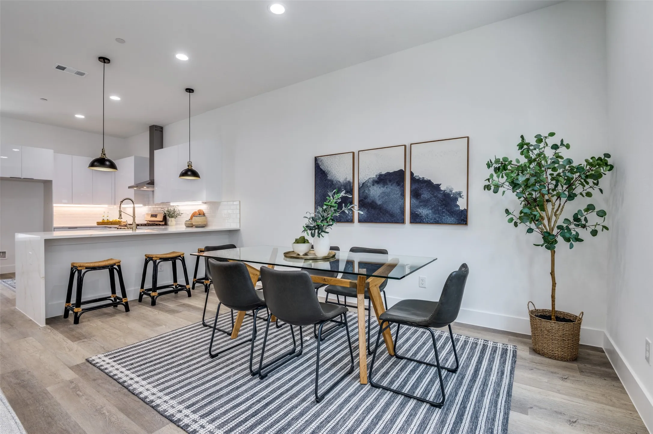Dining room featuring light wood finished floors and recessed lighting