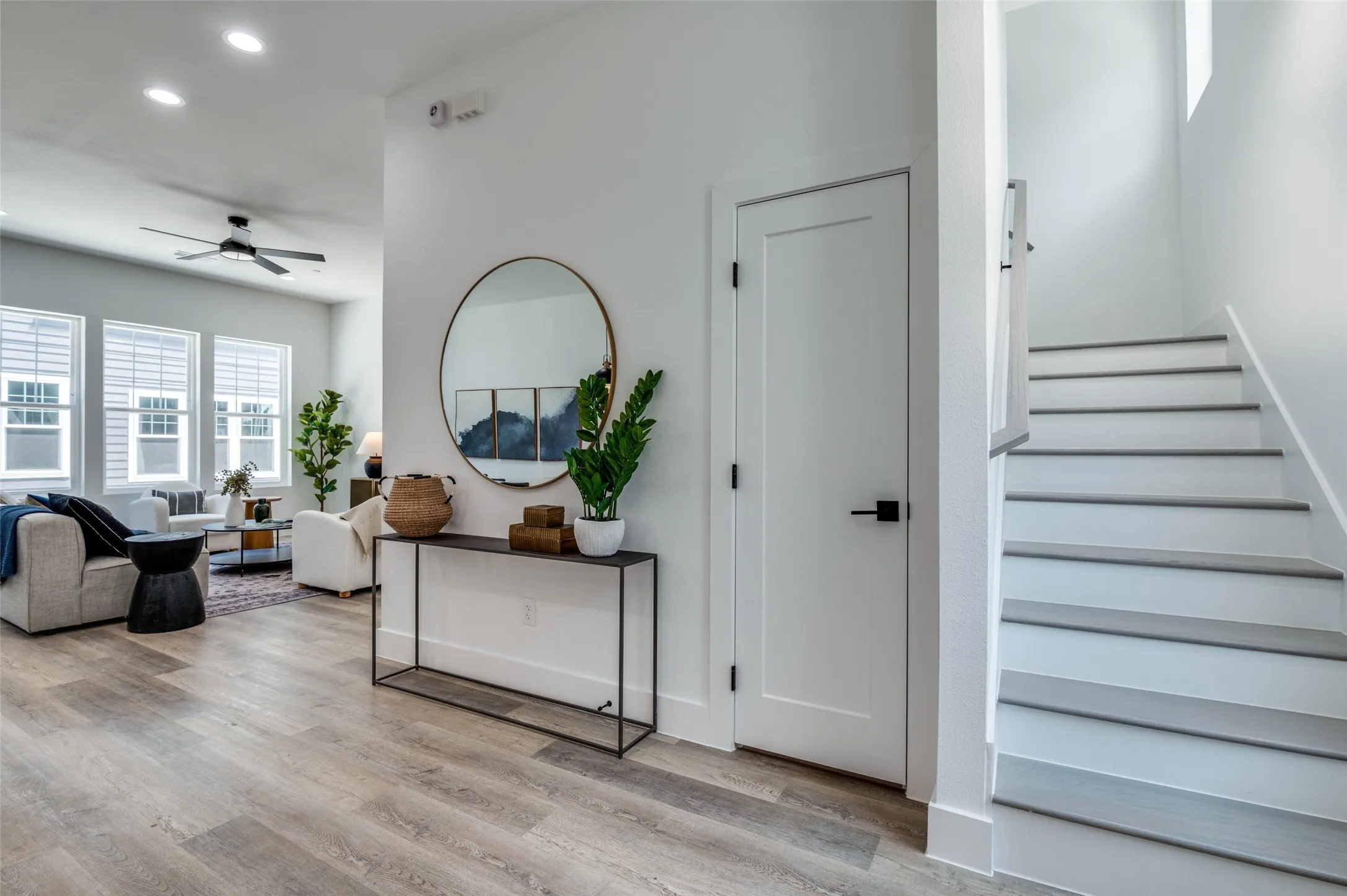Staircase featuring recessed lighting, ceiling fan, and wood finished floors